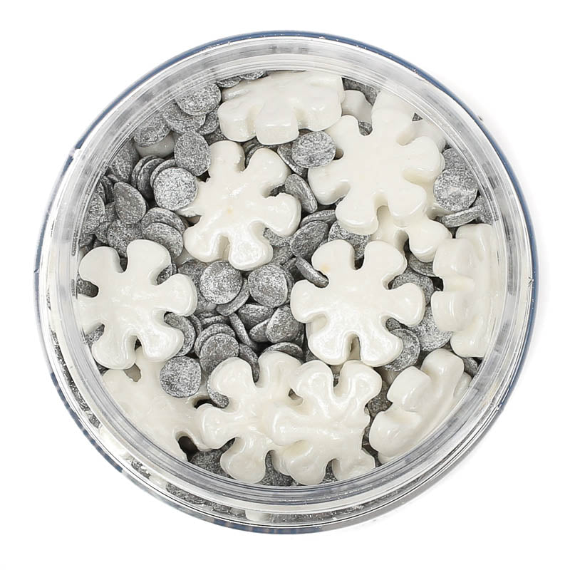 Image of container of white and silver snowflake shaped sprinkles for cake or cookie decorating. 