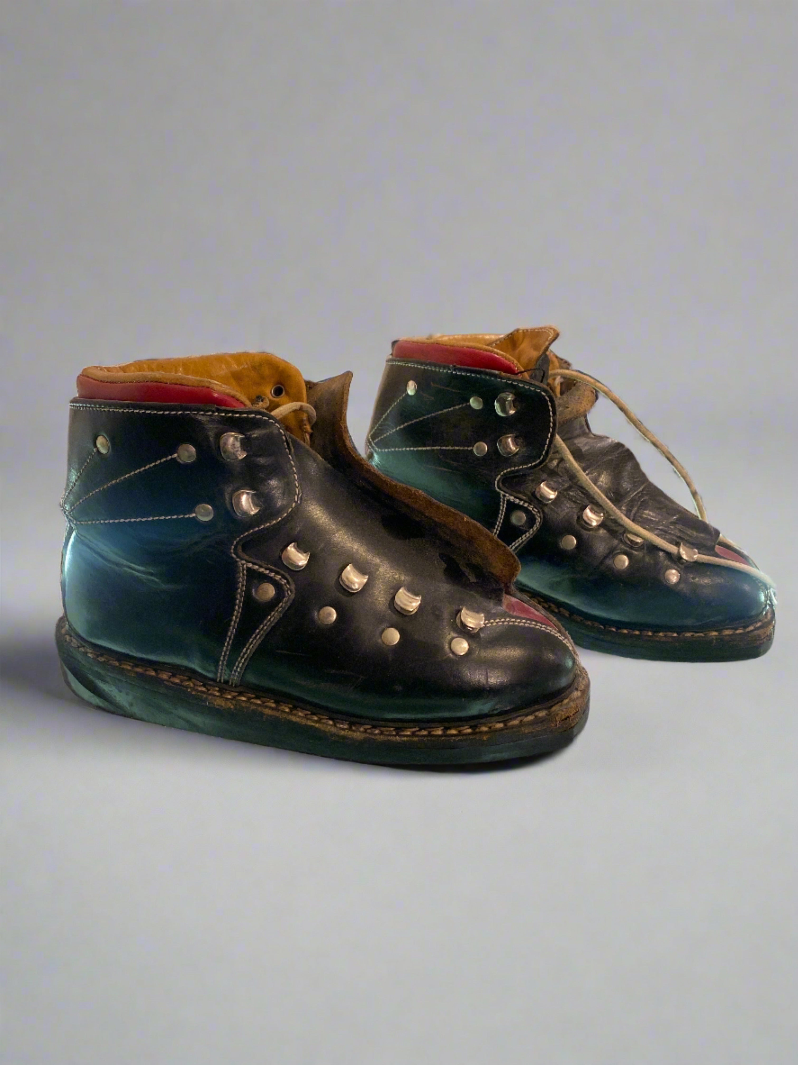 Vintage Koflach Snow Star black and red child's leather ski boots with double laces. side view