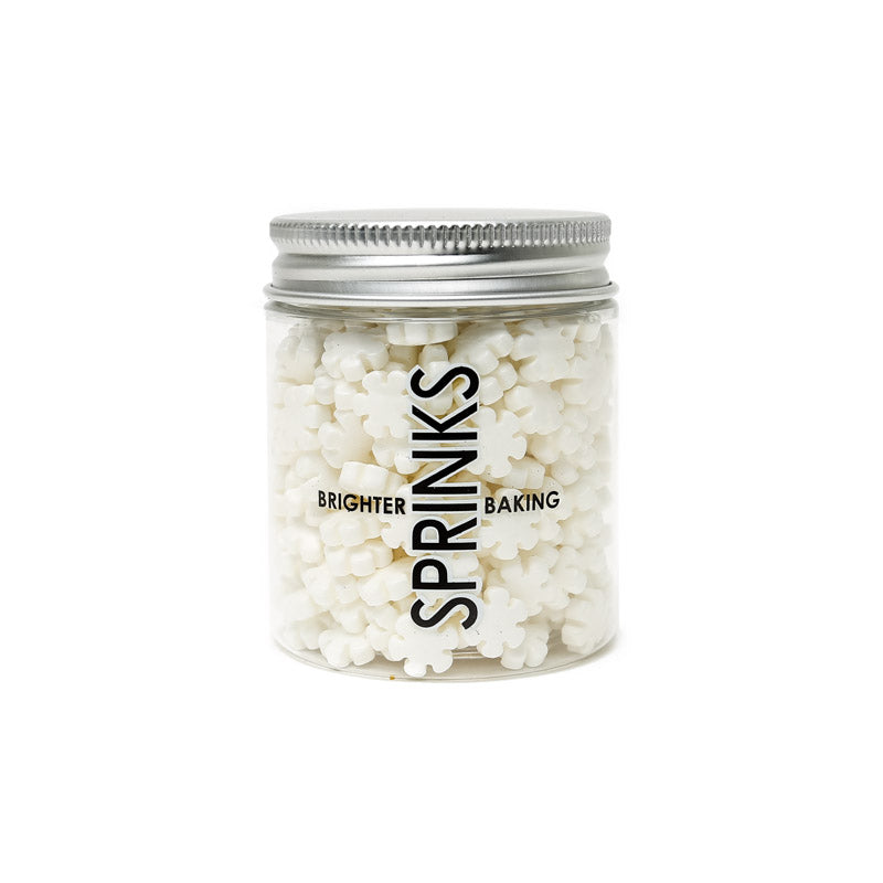 Image of container of white  snowflake shaped sprinkles for cake or cookie decorating. Front on view including label
