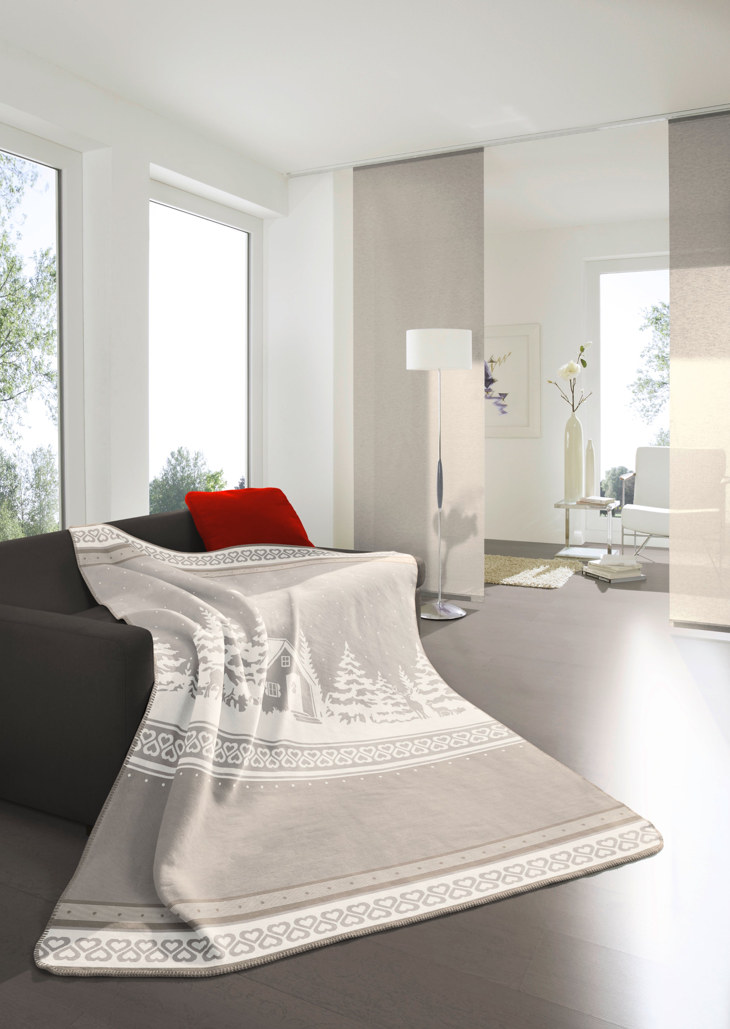 This image shows the Alpine Lodge blanket on top of a couch. 
