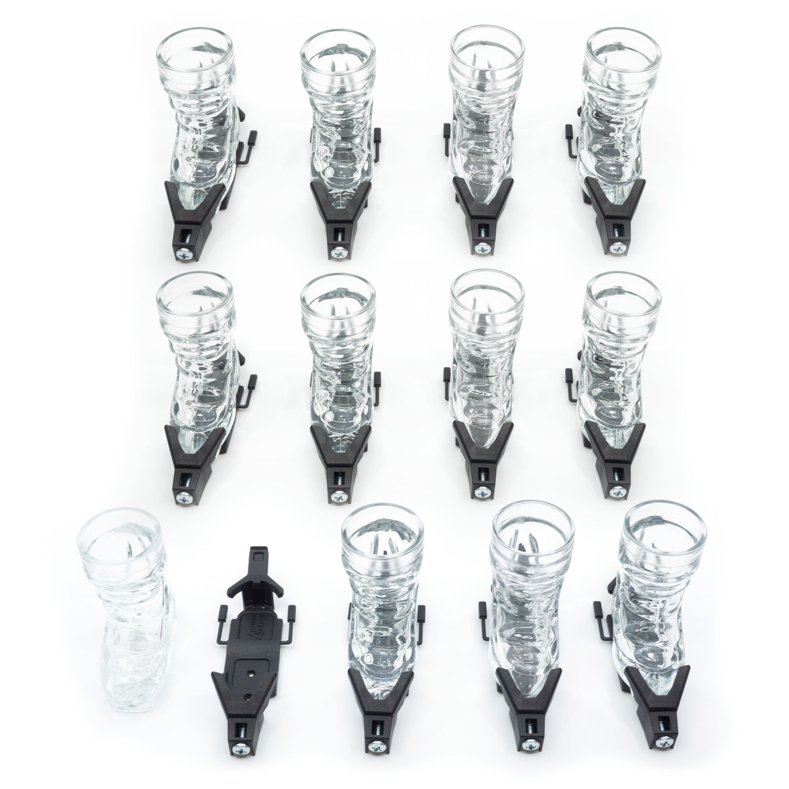 Photo of 12 Apr√®s Allstar boot shot glasses, in 3 rows of 4 glasses, with black bindings and red Apr√®s Allstar lanyards. 1 boot shot glass is out of its binding. Image is set against a white backdrop.