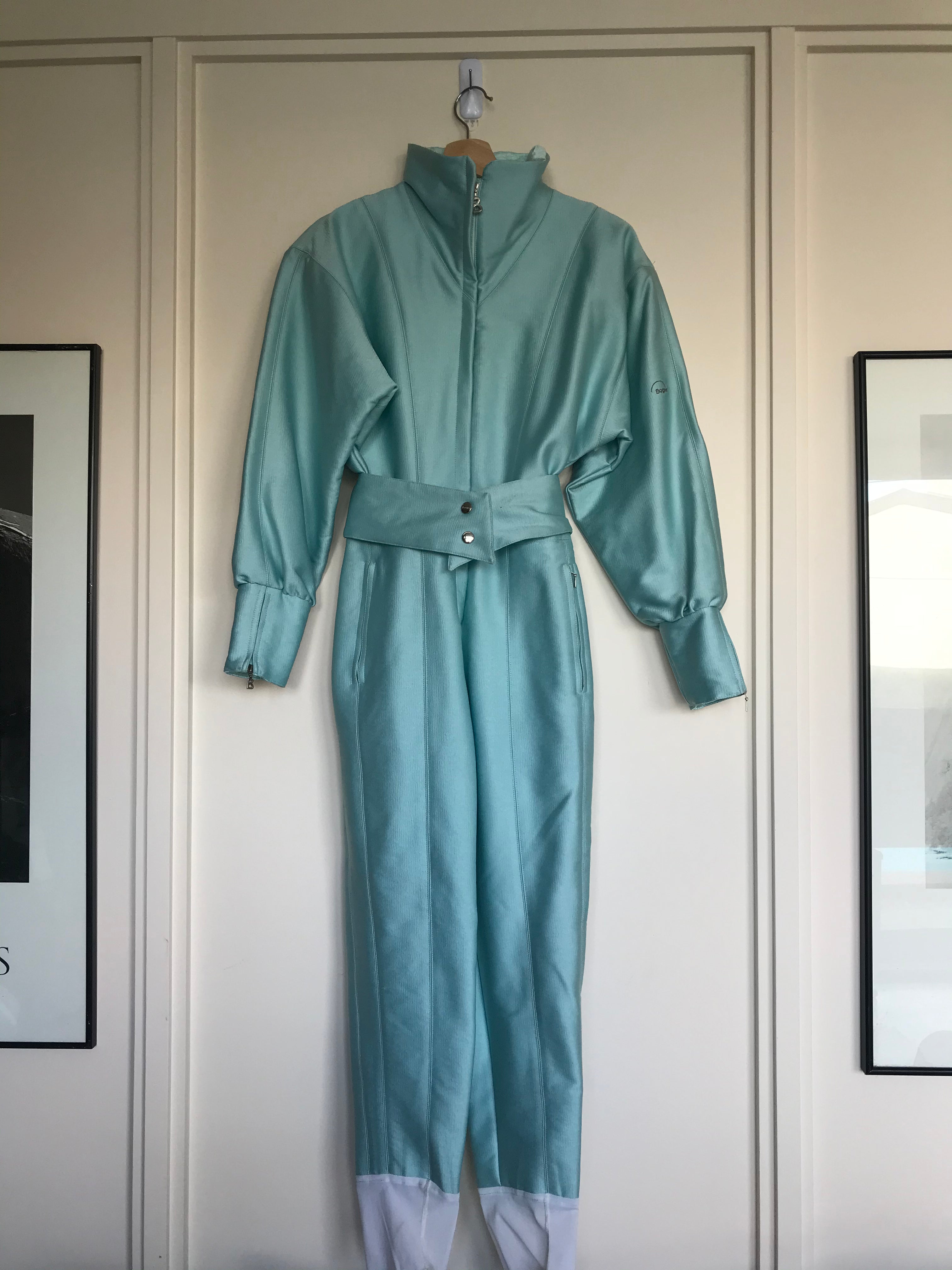 Vintage Bogner Iridescent Pale Baby Blue One Piece Ski Suit with Belt. Front