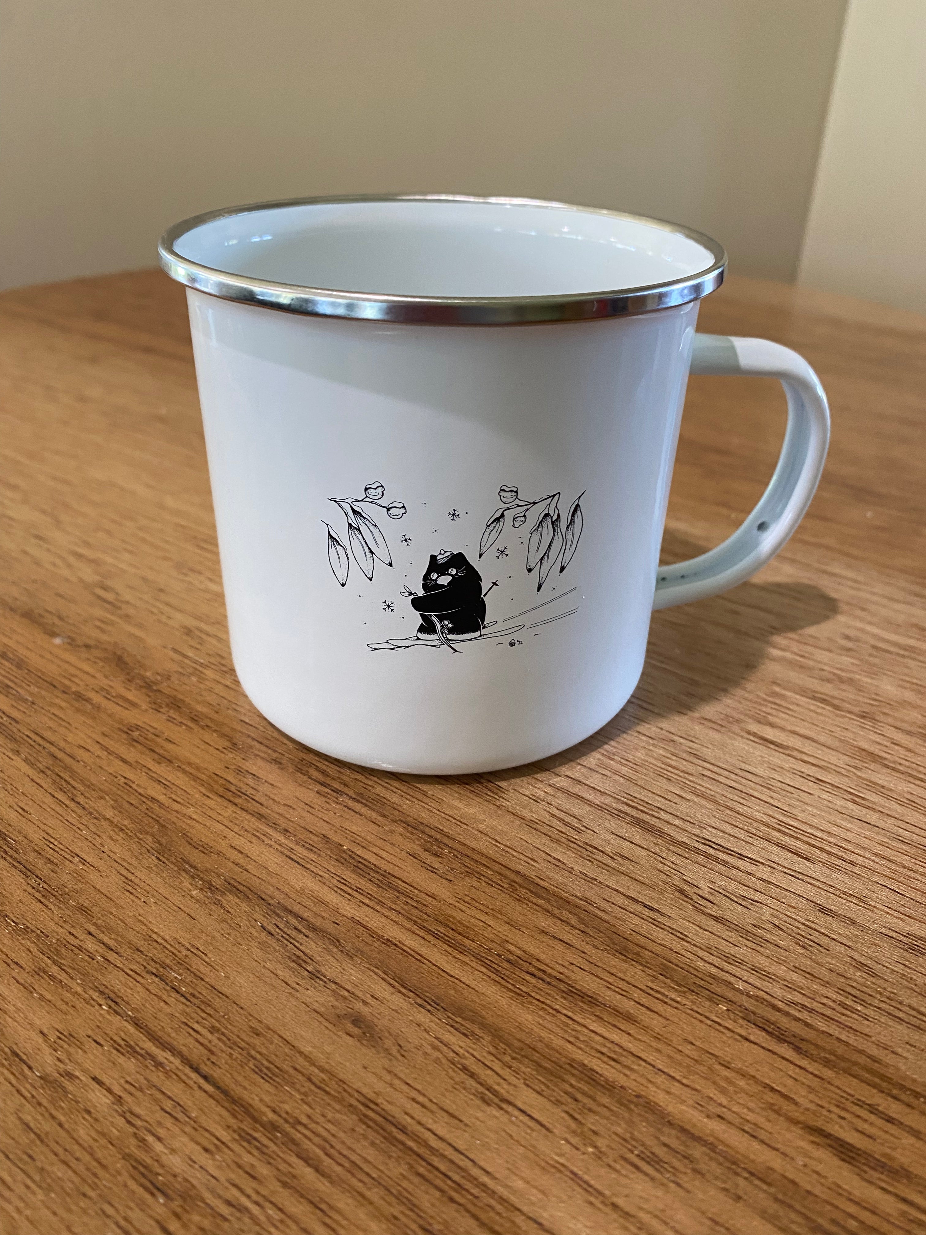 Skiing wombat enamel mug