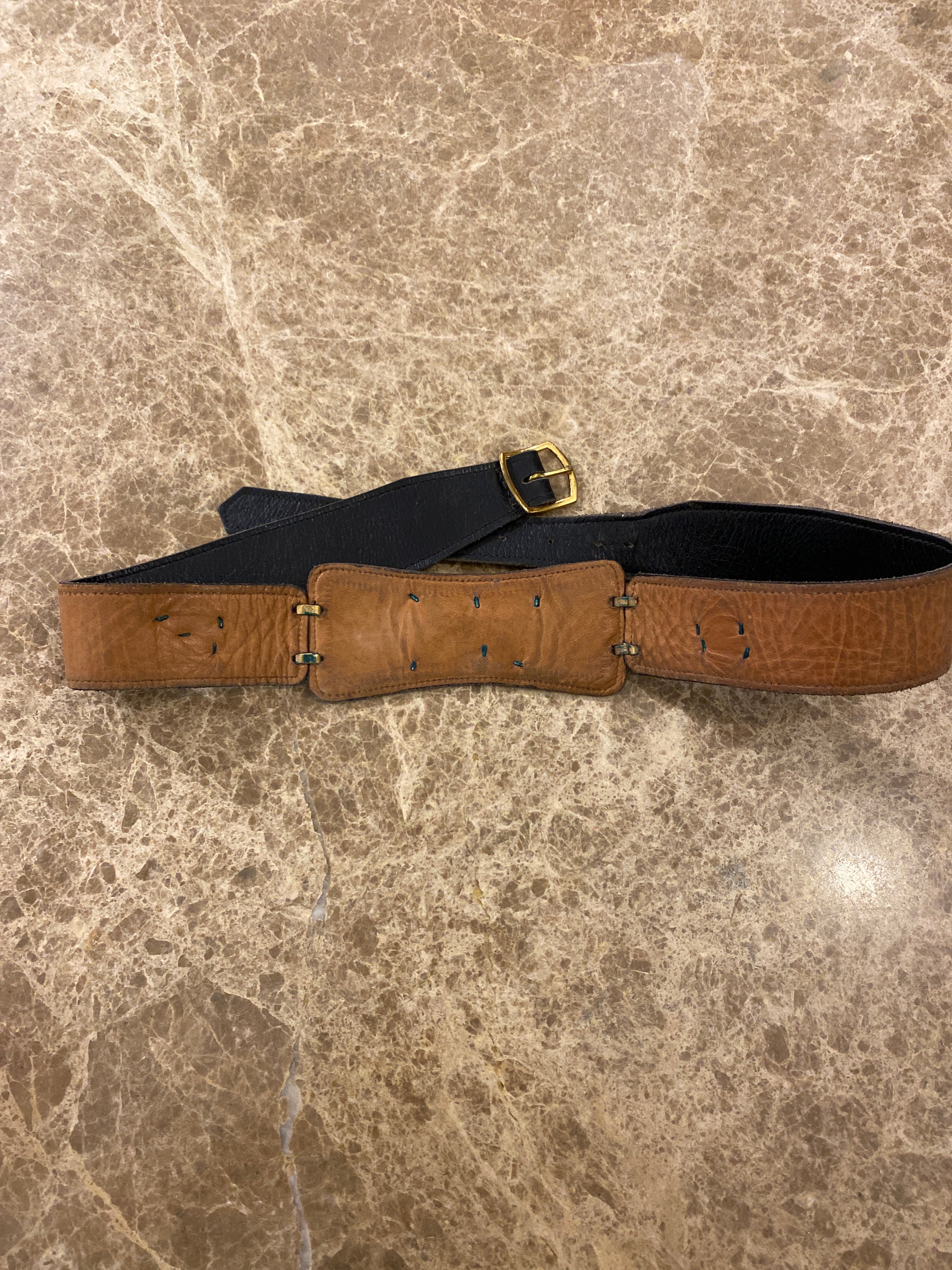 Vintage dark brown leather belt that is designed to buckle at a persons back, with three beautiful enamel embellishments attached to the belt. Back of belt