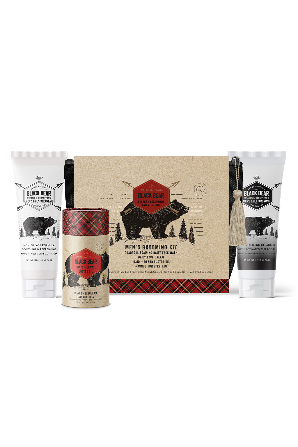 Image of Black Bear Men's Orange & Cedarwood Grooming Gift Set: a dark coloured toiletry bag, a tube of face wash, a tube of face cream and a container of hair & beard lustre oil