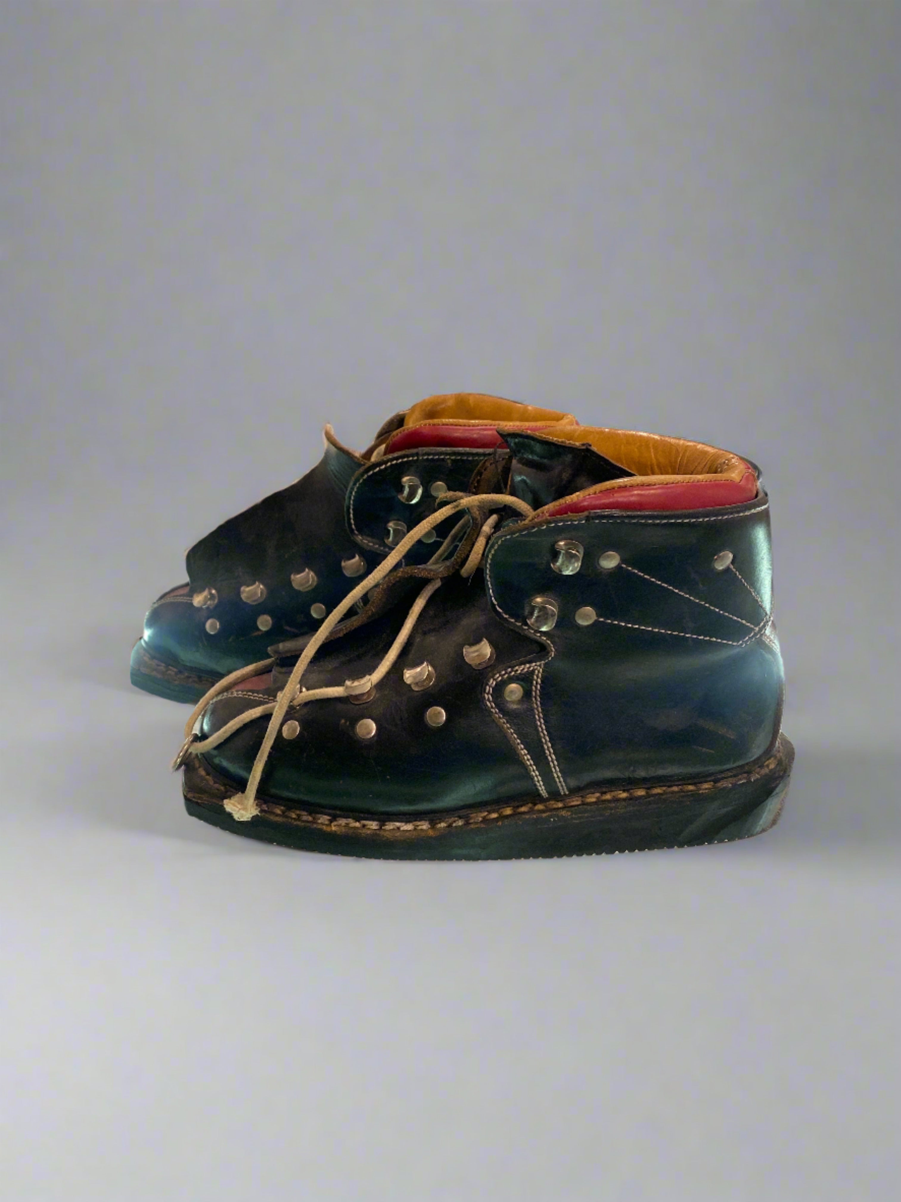 Vintage Koflach Snow Star black and red child's leather ski boots with double laces. side view