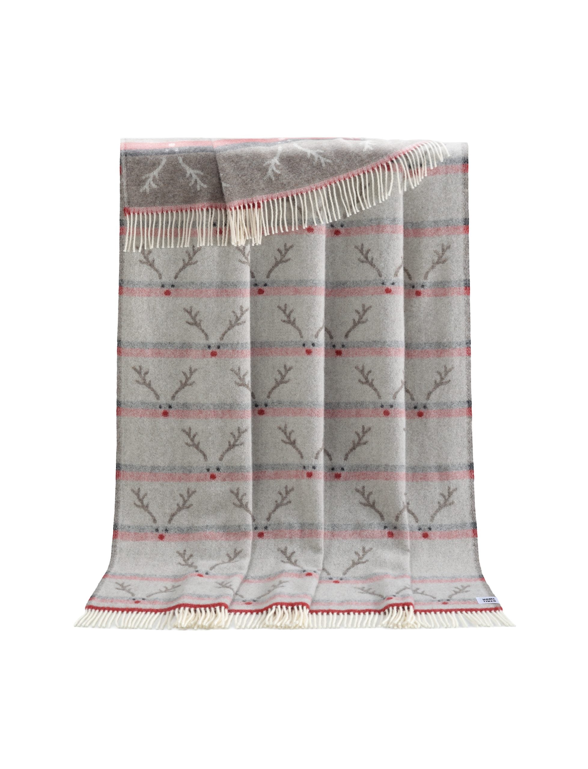 Image of a folded soft red, brown & black throw rug with stylised reindeer head and antlers woven into the pattern
