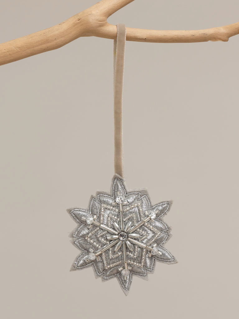 Hanging silver beaded snowflake 8cm, hanging from a branch