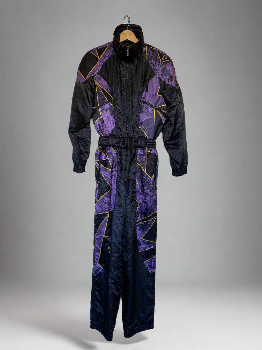 Vintage Head Star Of The Hill one-piece snow suit in black with purple stars outlined in gold. 