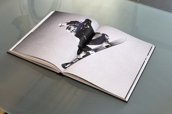 Heroes: women in snowboarding hardcover book. Book open showing photograph