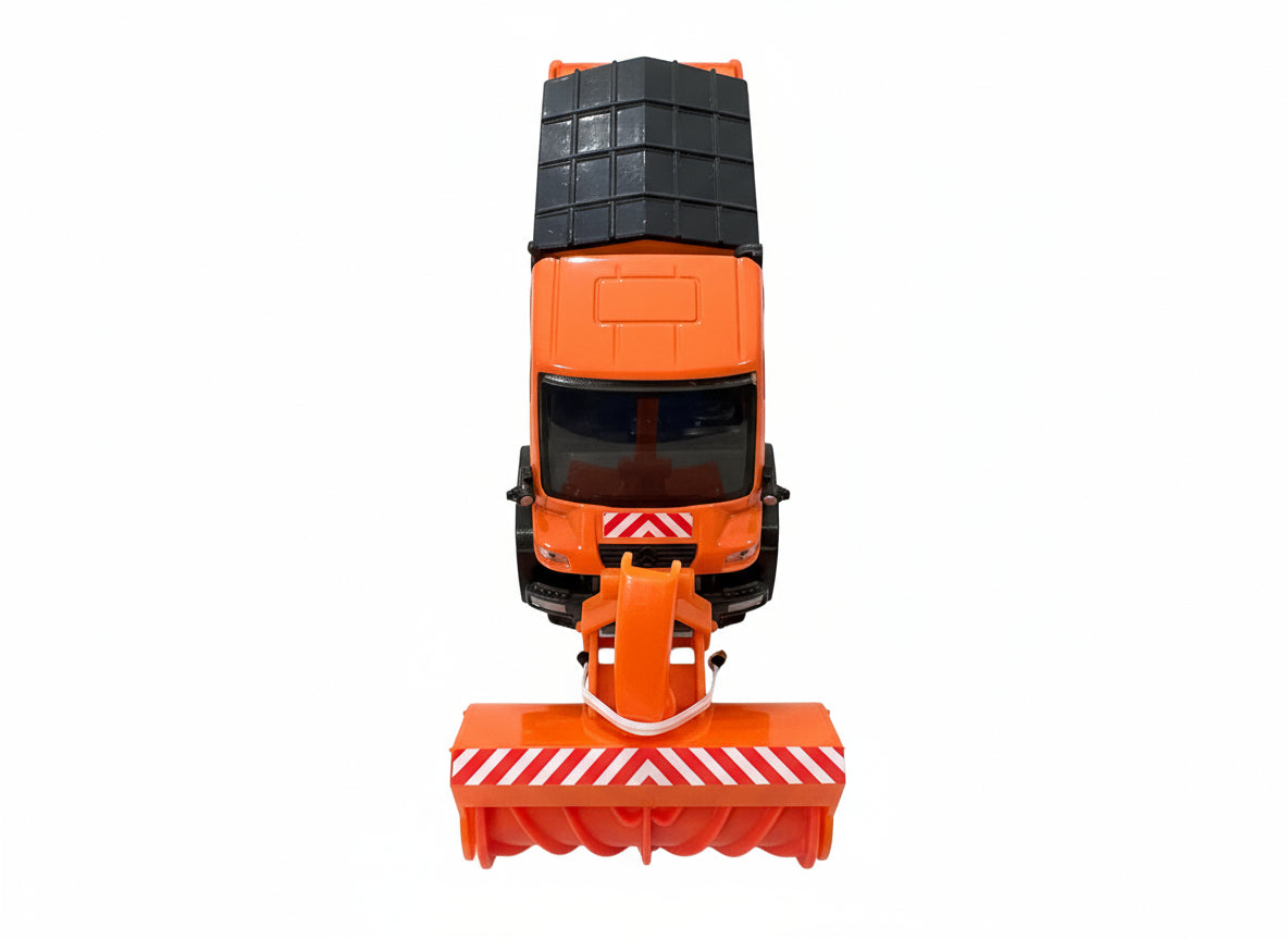 This image shows the Jaegerndorfer Snow Clearing Truck with snow blowers attachment from the front and above, in part of it's blue and red box on a white background. 
