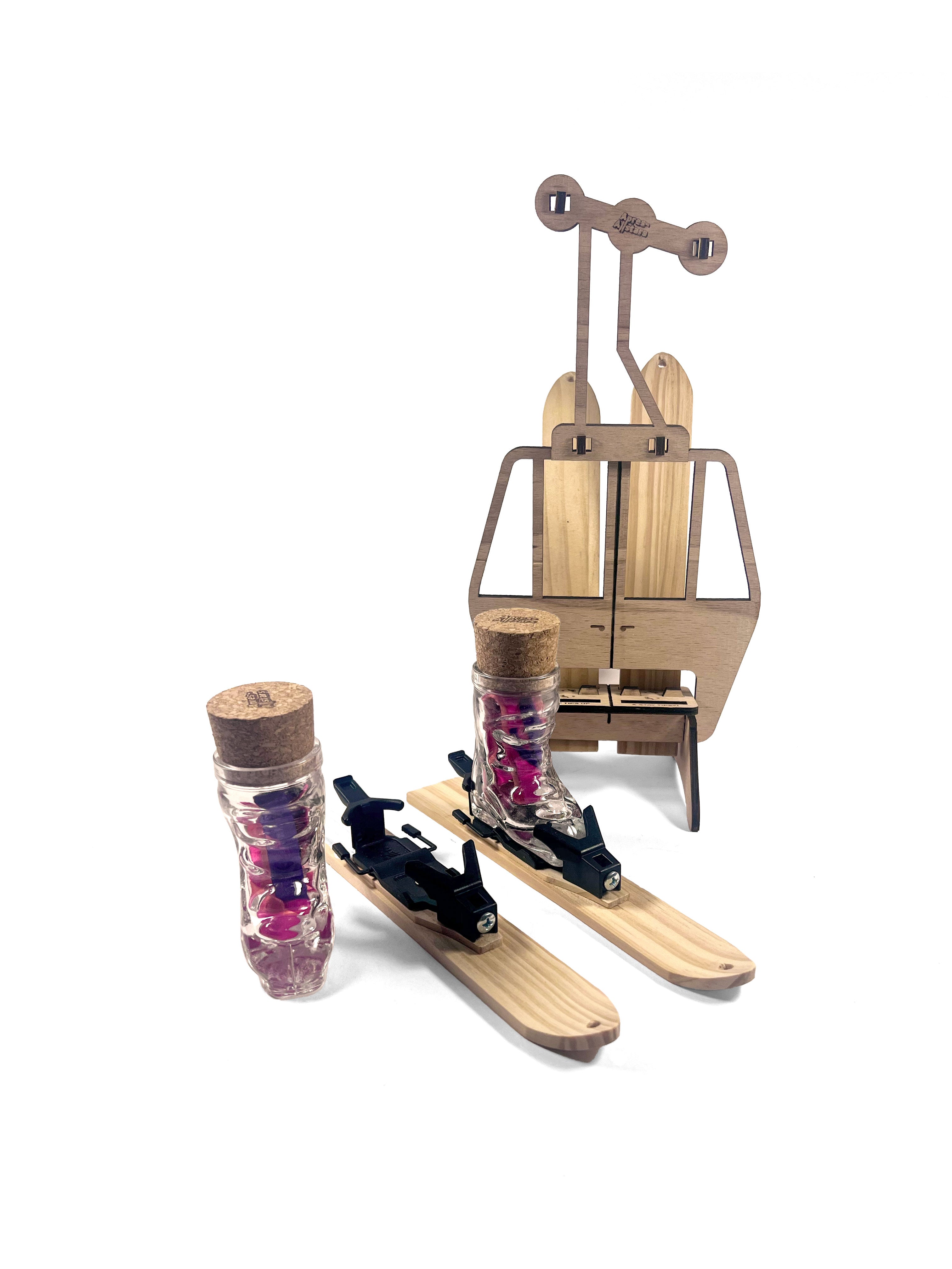 Apres-Allstars® Party Gondola for 4x MiniSki. Gondola shown with 2  Apres Allstars MiniSkis  facing away and 2 MiniSkis, Bindings, Glasses, Lanyards and corks.