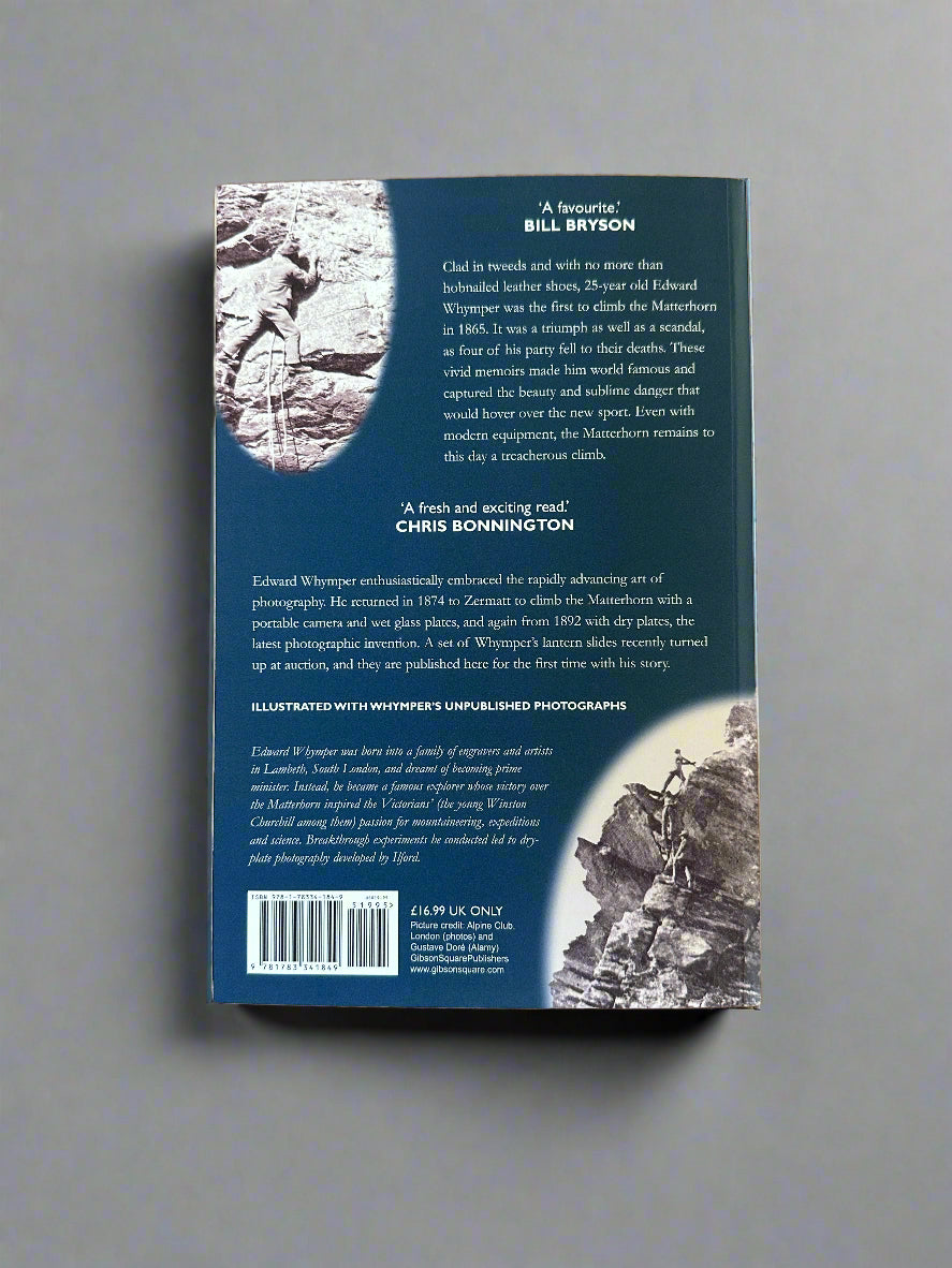 Back cover of the book The Ascent of the Matterhorn. Blue background with  two photos showing rocky mountains and people with climbing gear ascending the rock, amongst white text and a barcode. Book shown against a grey background.