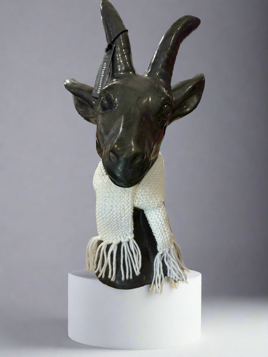 Chehoma Silver Goat Statue modelling the white wool dolls scarf. Goat Statue not sold separately.