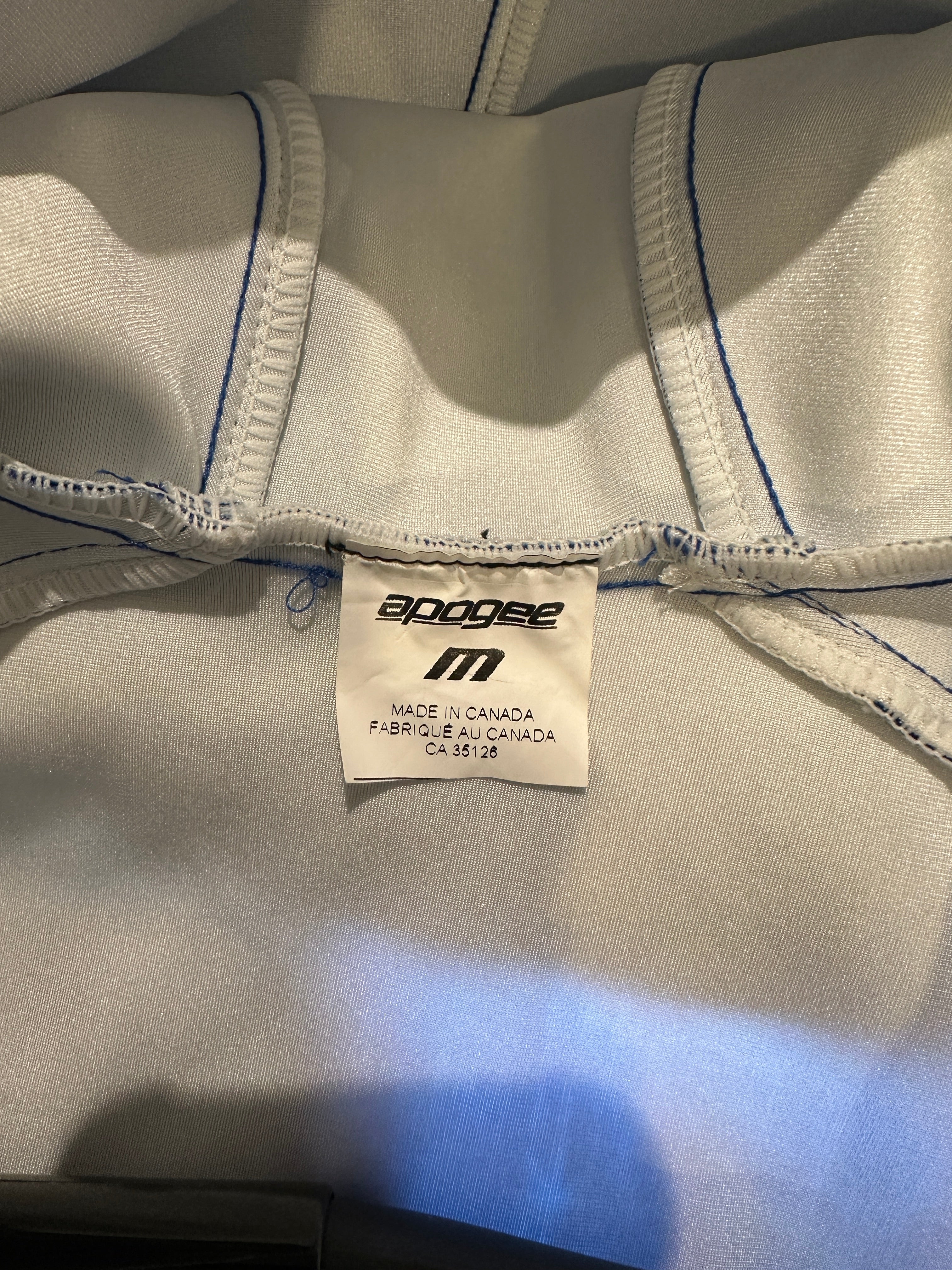 Early 2000's Fall Creek Race Club Padded Race Shell. Print on fabric featuring the words 'falls creek race club' and the 'swish' logo in navy and light blue. Size label. M