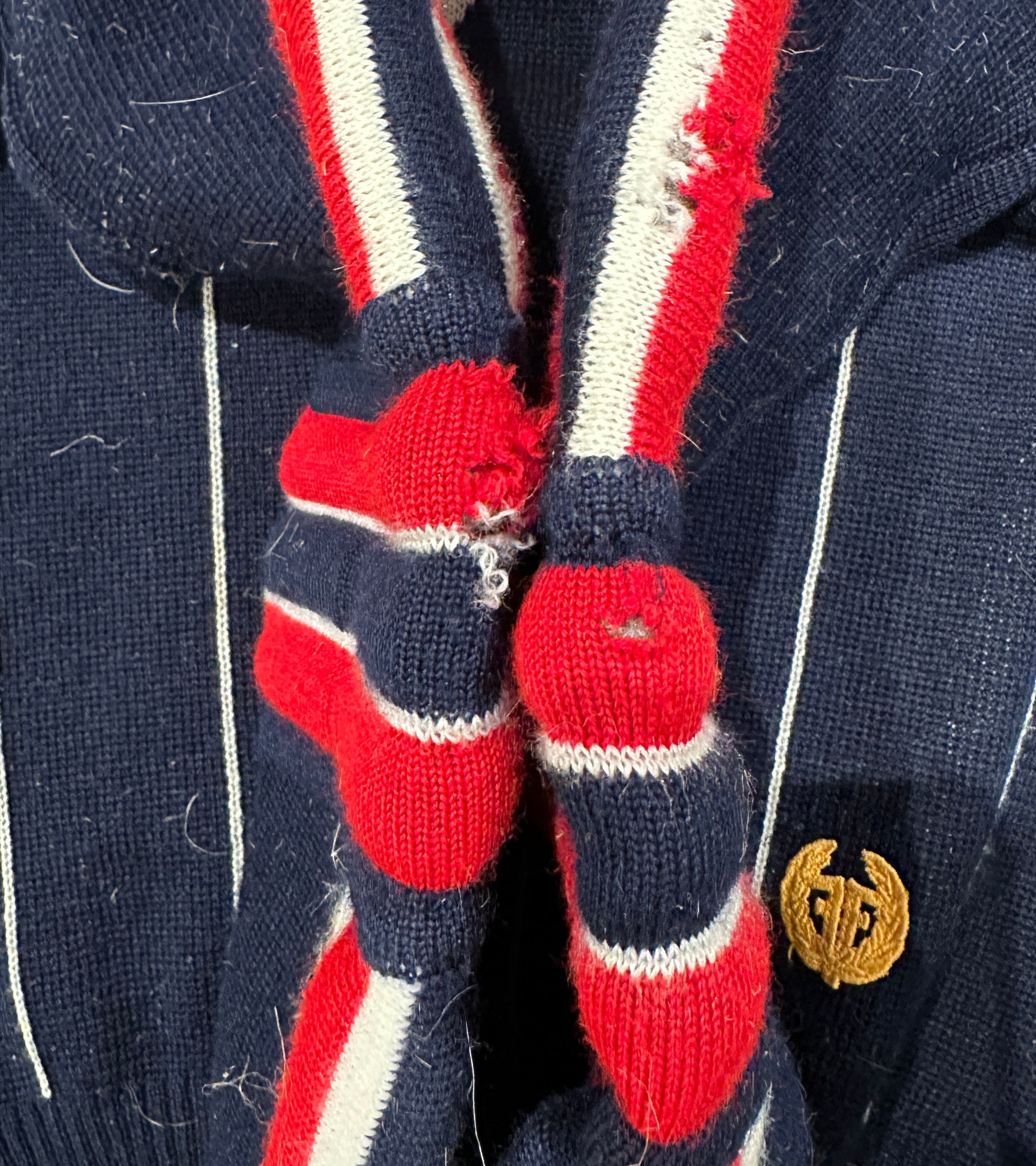 Vintage Flad  Navy Red White Padded Ski Race Jumper. Holes in elbows (jutes rug fibres from being laid on the rug to photograph. Have been removed)