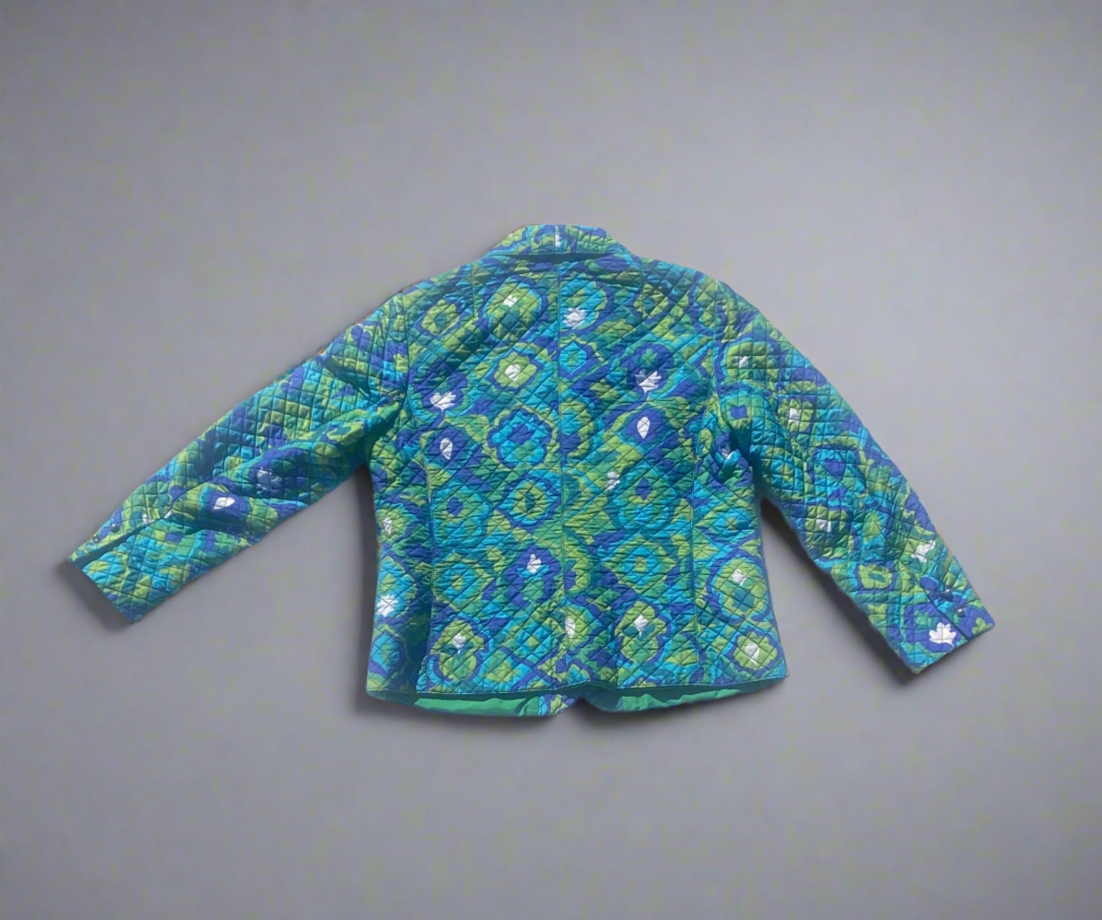 Vintage Bogner Vintage Bogner green, navy, teal blue quilted jacket with a floral pattern. Rear View