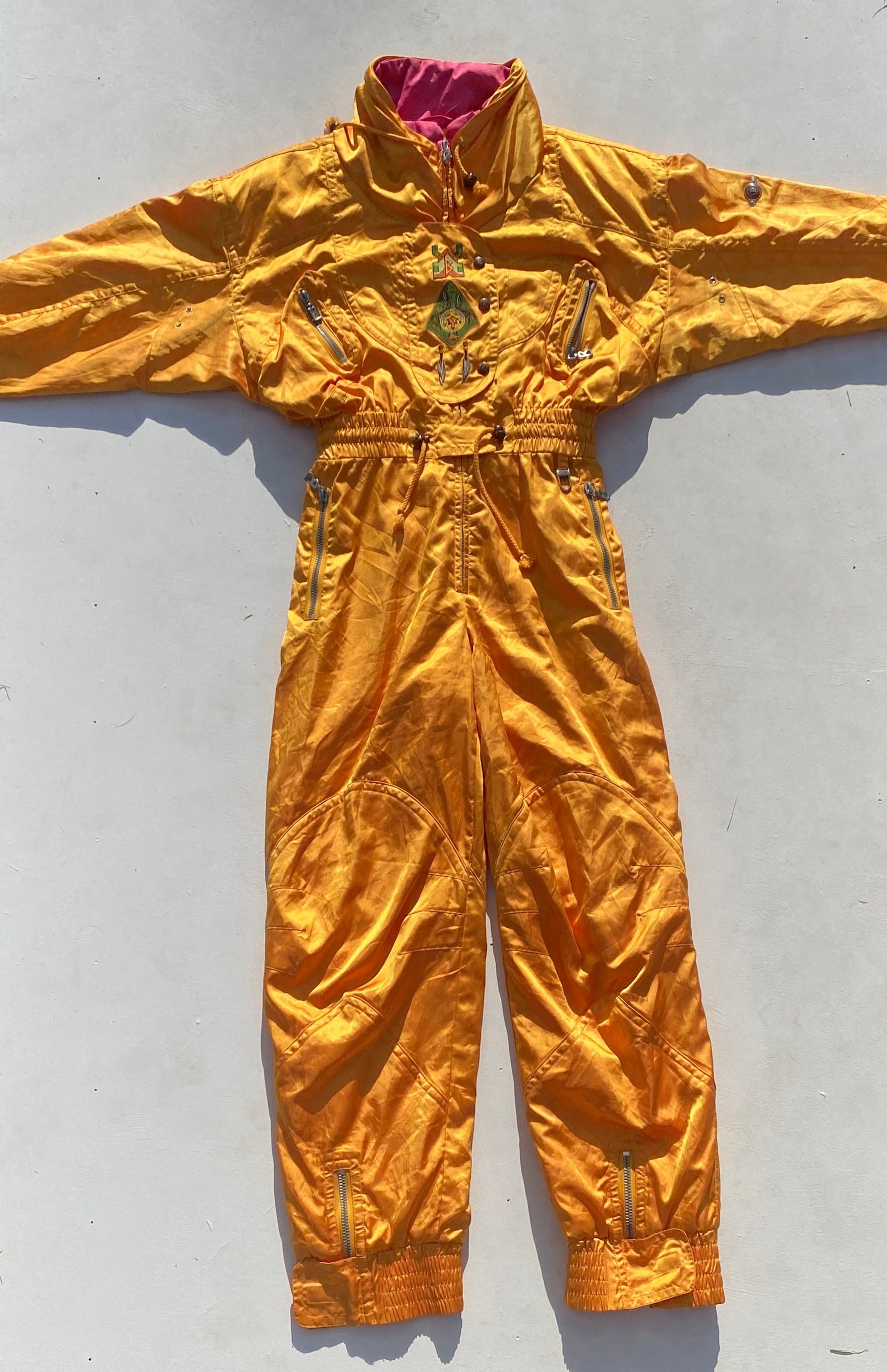 Vintage Bogner Egg Yolk Yellow with Pink Collar One Piece Ski Suit (Hire)