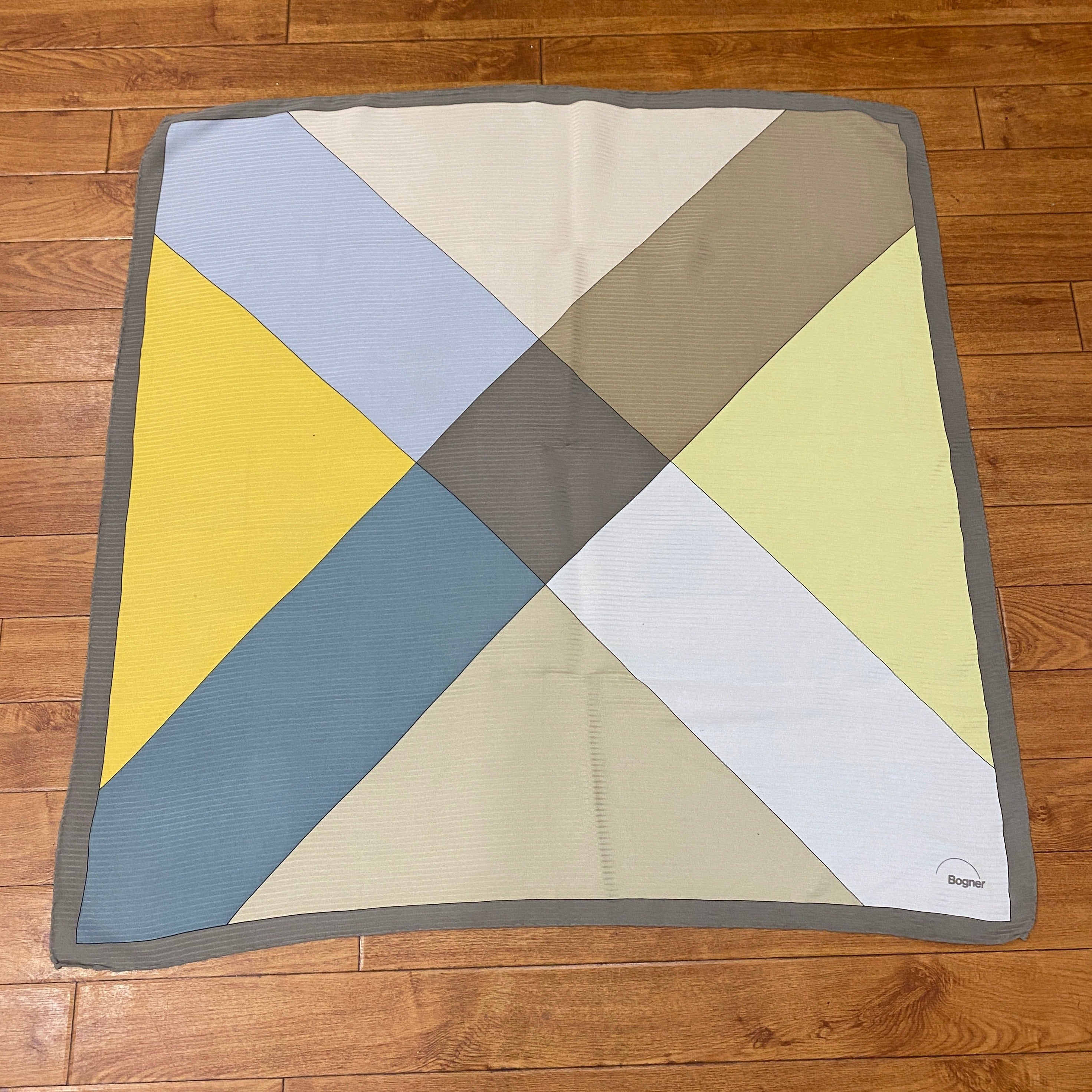 Bogner Geometric Print Silk Scarf, shown against a wooden background