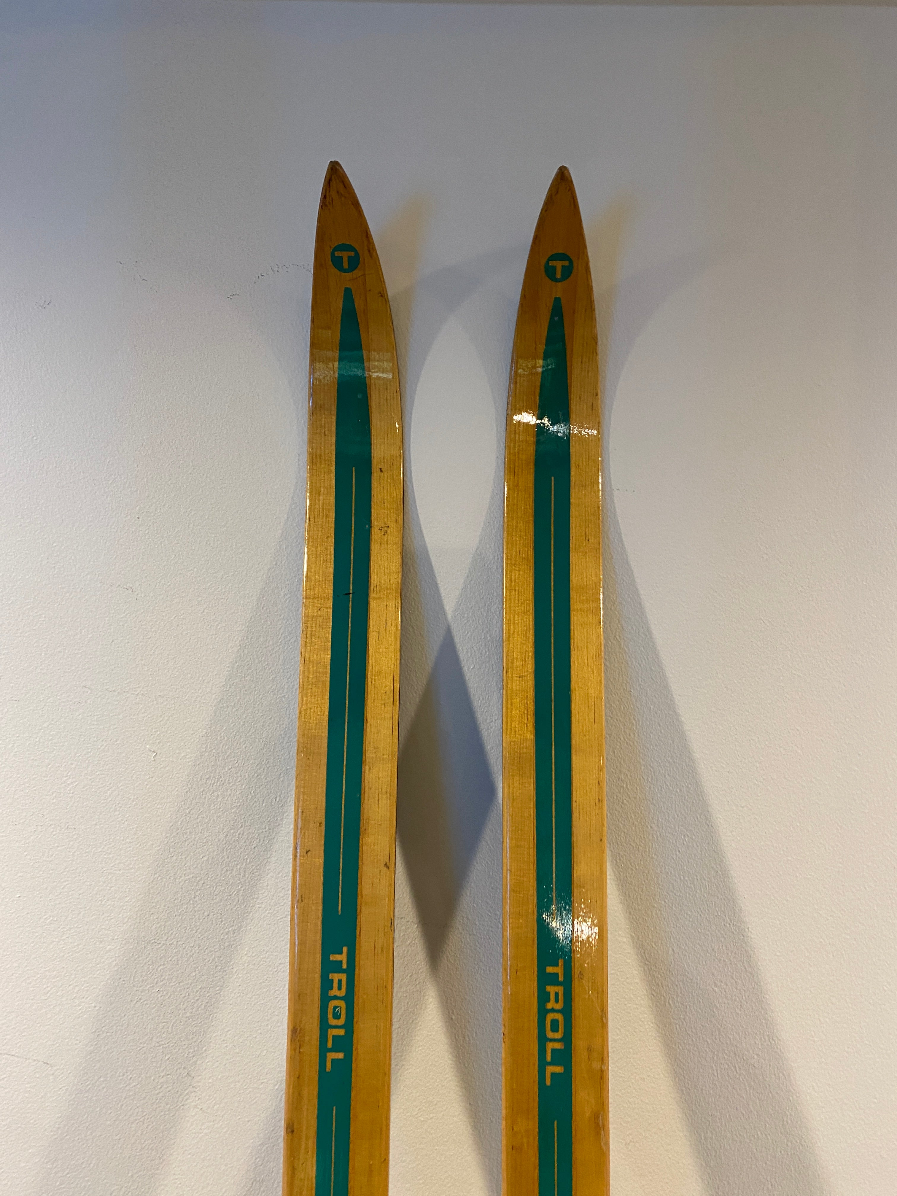 Vintage Troll 196cm skis, mounted with a pair of vintage 3-pin Rottefella bindings, ski tips