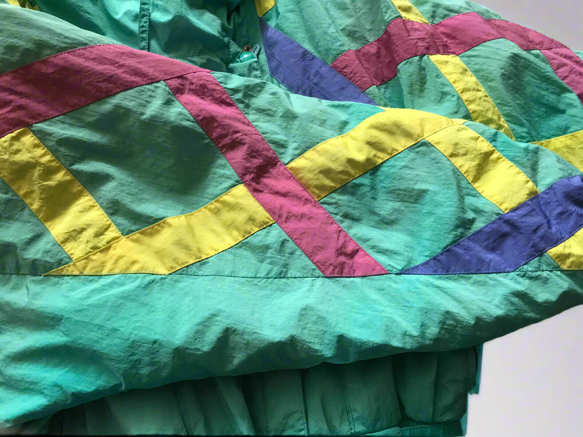 Vintage Mossant Teal Green 1-Piece Ski Suit With Belt. Close up on ribbon detail