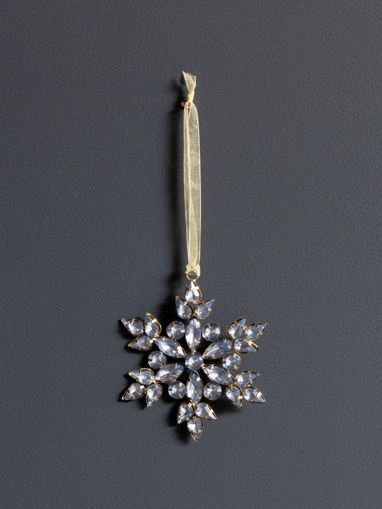 Silver Blue bead snowflake hanging ornament against a dark background