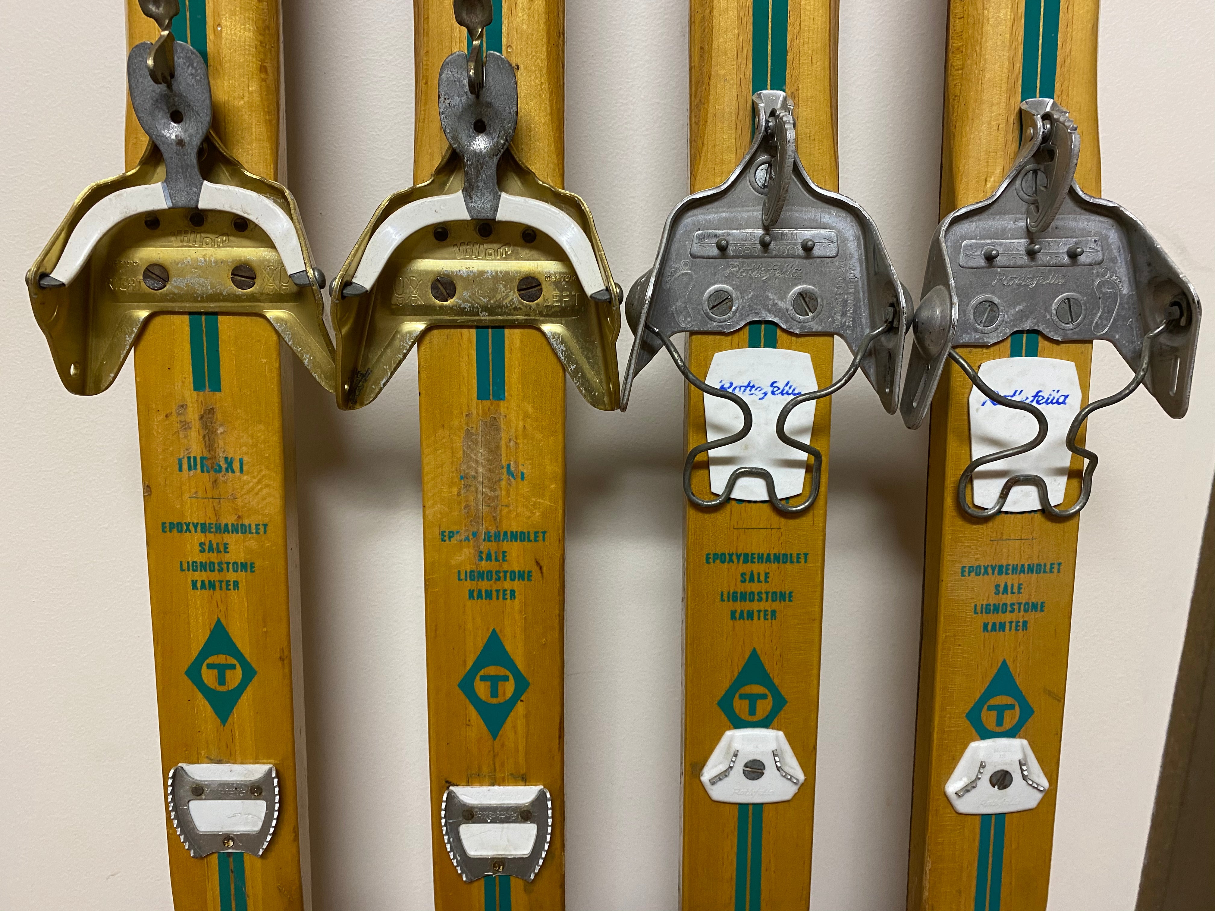 2 pairs of Vintage Troll Wooden Nordic Skis, close up of bindings