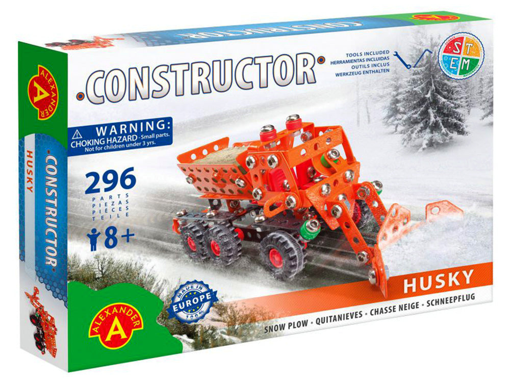Photo of the toy box of the Constructor Husky Snow Plough, showing an orange vehicle driving along a snowy landscape and ploughing the road to clear it.