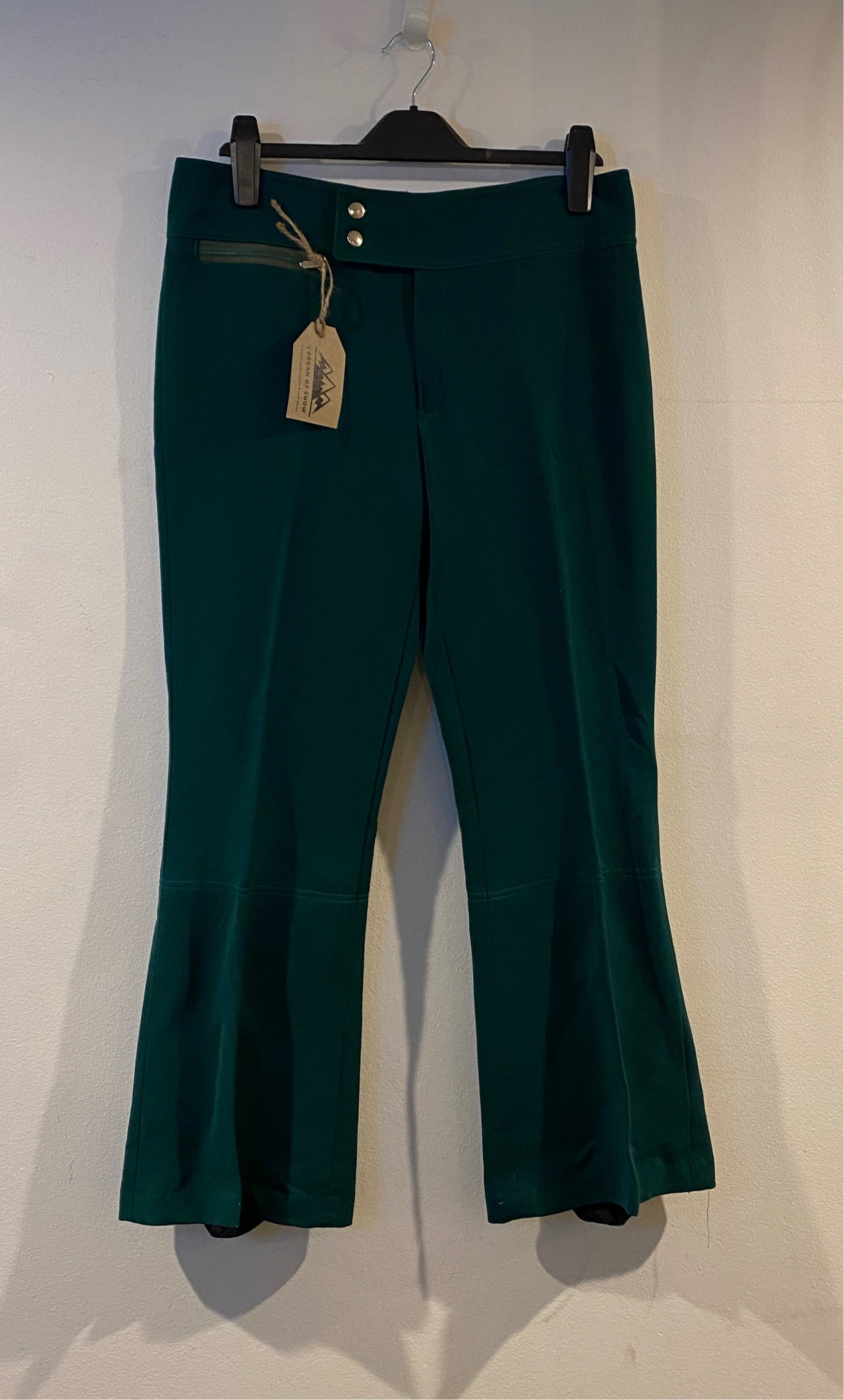 Vintage Olympia green ski pants. hanging front view