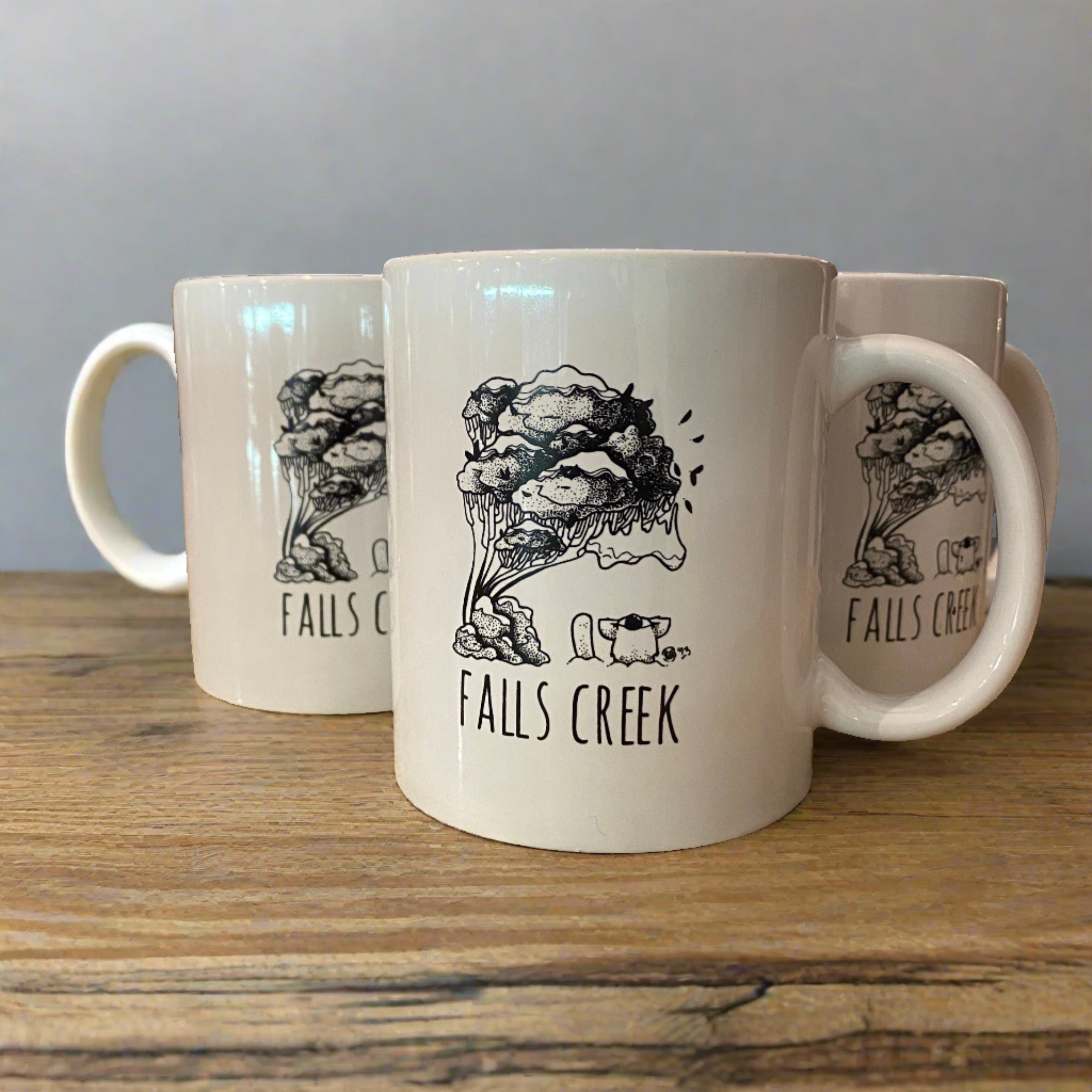 Falls Creek Agent K Ceramic Mugs. set of 3 on wooden bench