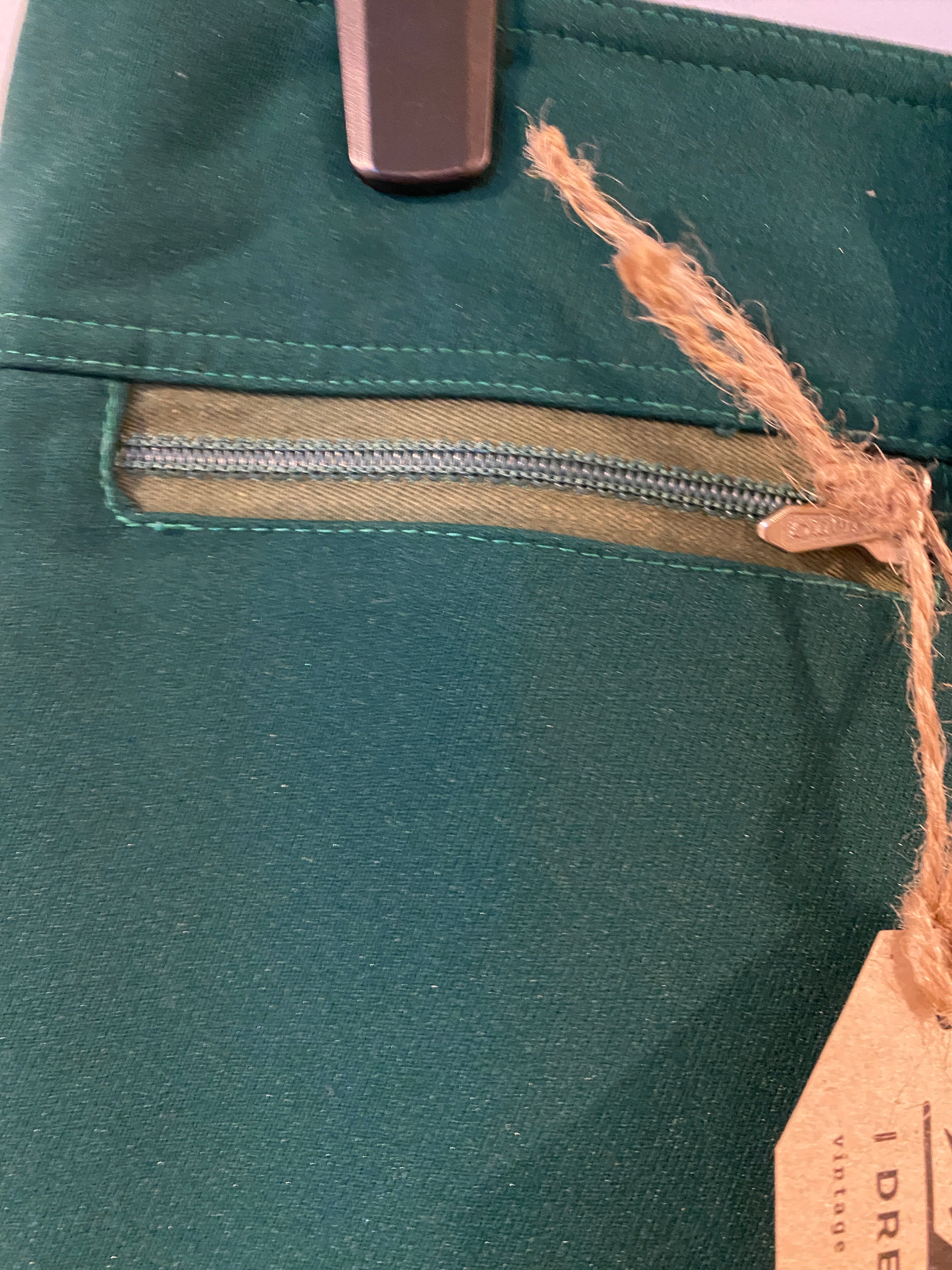 Vintage Olympia green ski pants; front pocket