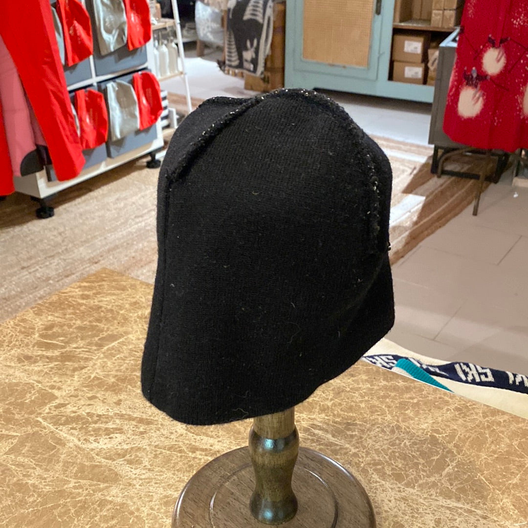 Black & White Snowflake Pattern Beanie shown on hat stand, shown inside out