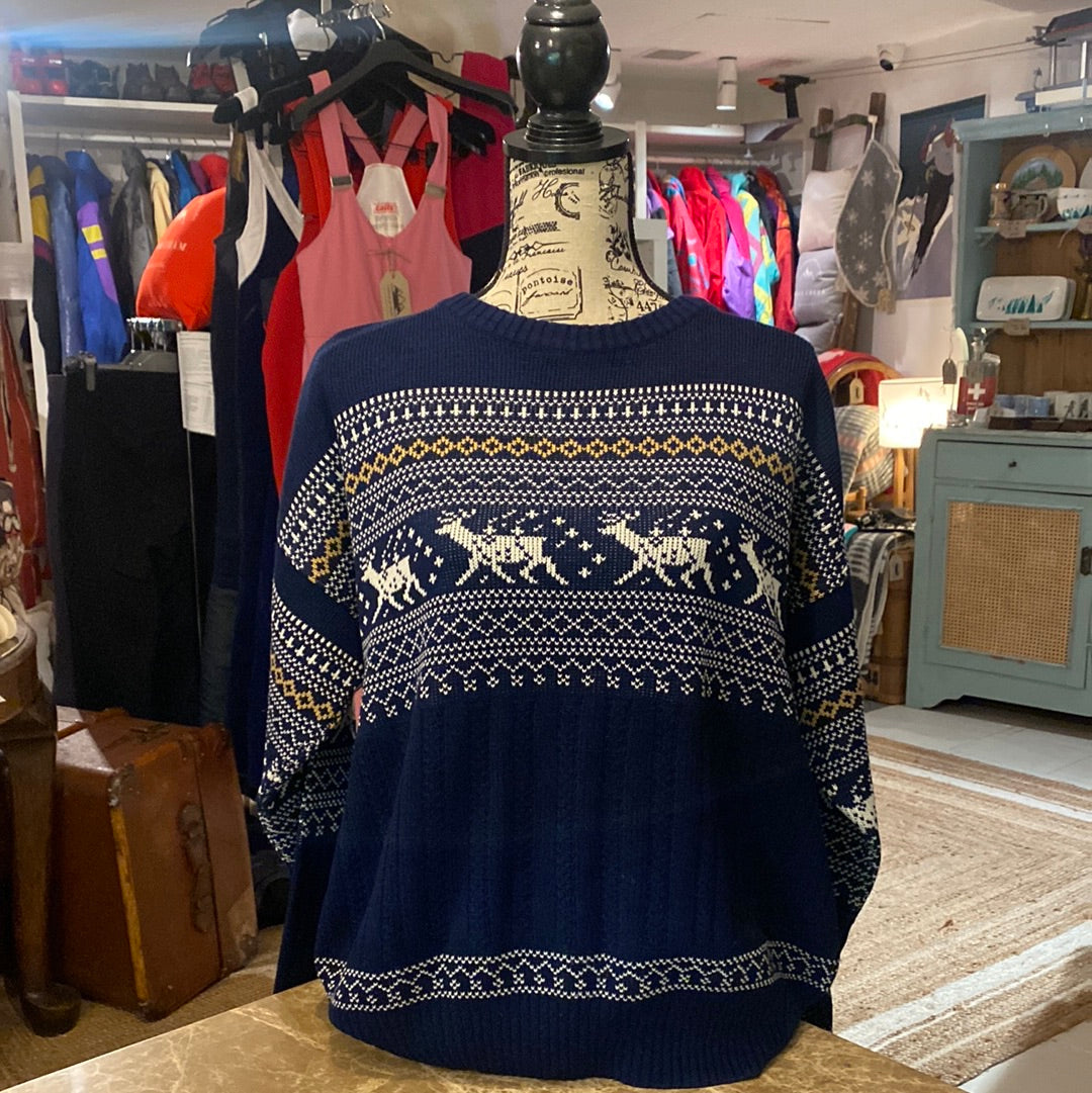 Blue vintage Botany 500 Ski Jumper with reindeer pattern in white and tan featured on a navy blue background. Front of jumper