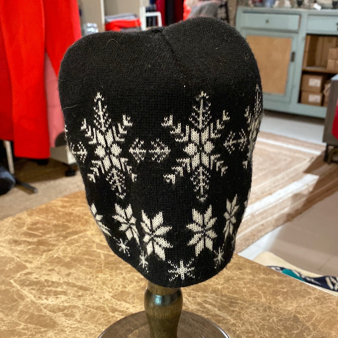 Black & White Snowflake Pattern Beanie shown on hat stand