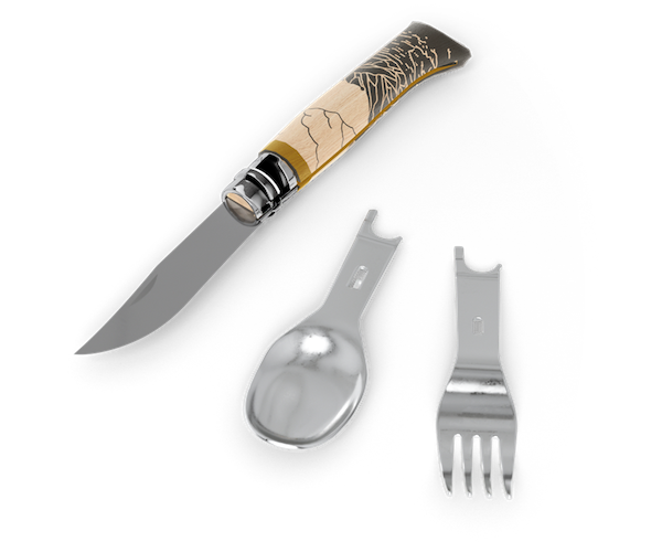 Hiking cutlery handle and knife/spoon/fork kit and napkin on a white background. Cutlery handle has a mountain scene etched into it