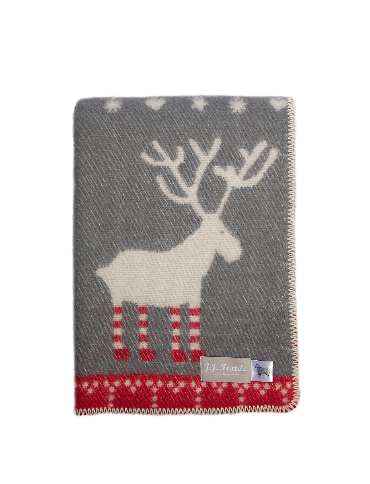 Image of a folded soft red, light grey & dark grey blankty with stylised standing reindeer with red and white socks woven into the pattern