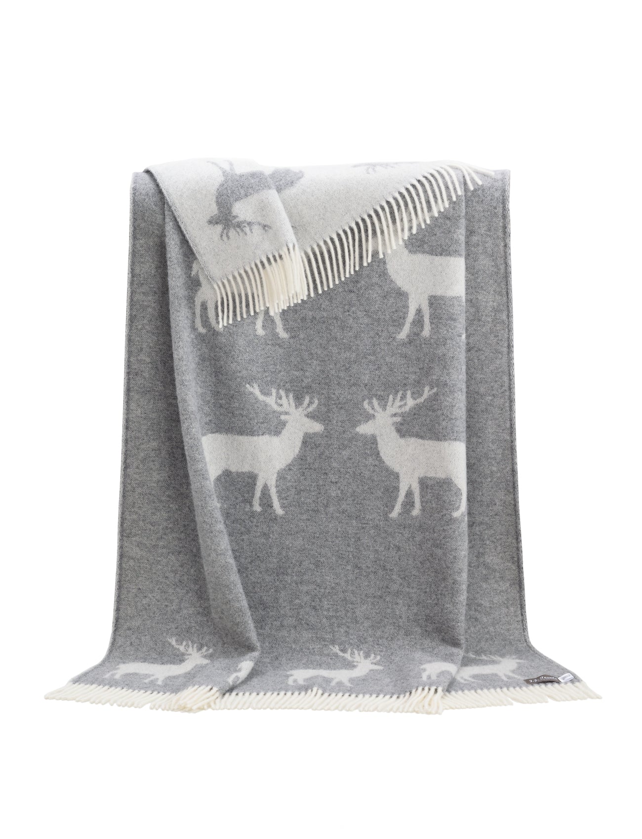 A throw rug, in a neutral soft grey with off-white deer design and made from 100% wool. Shown unfolded so the entire pattern is visible.