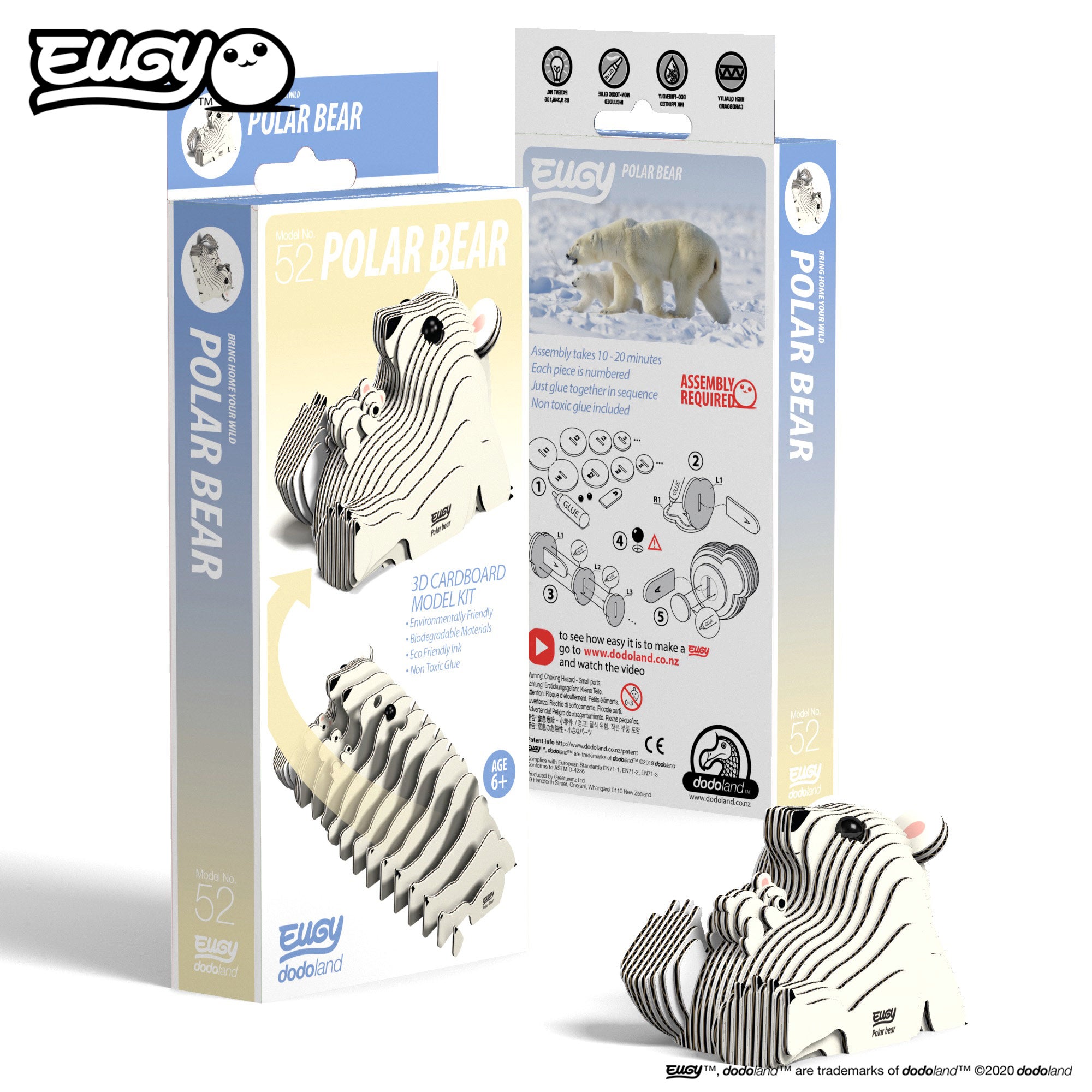 Image of an EUGY Polar Bear & Cub, facing slightly left and viewed from the front. In front of two EUGY Kangaroo Boxes, 1 showing the front cover and the other showing the rear of the box, against a white background