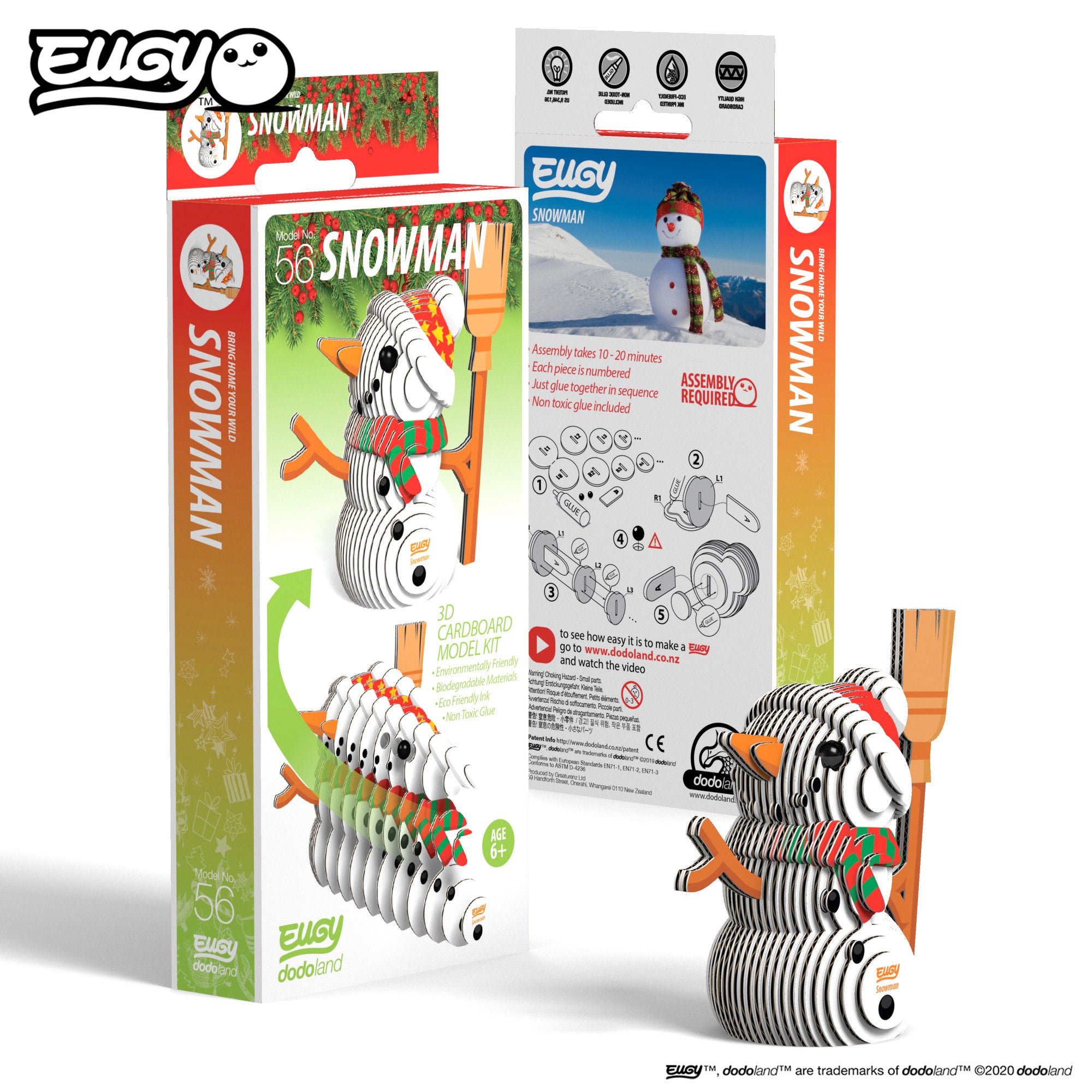 Image of an EUGY Snowman, facing slightly left and viewed from the front. In front of two EUGY Kangaroo Boxes, 1 showing the front cover and the other showing the rear of the box, against a white background
