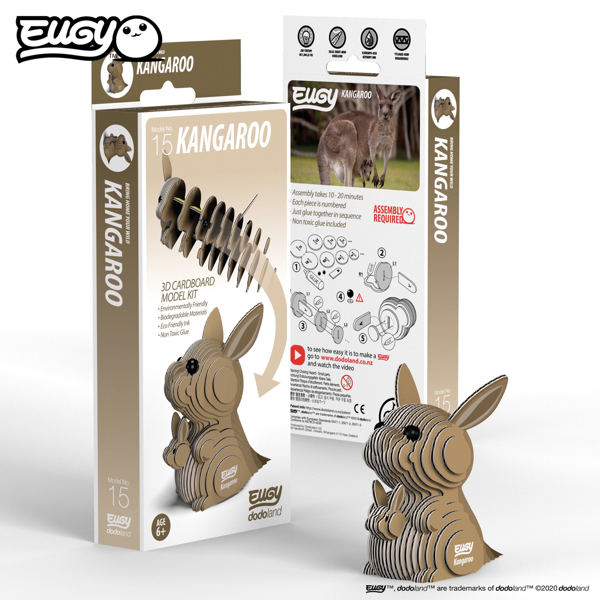 Image of an EUGY Kangaroo & Joey, looking left  in front two EUGY Kangaroo Boxes, 1 showing the front cover and the other showing the rear of the box, against a white background
