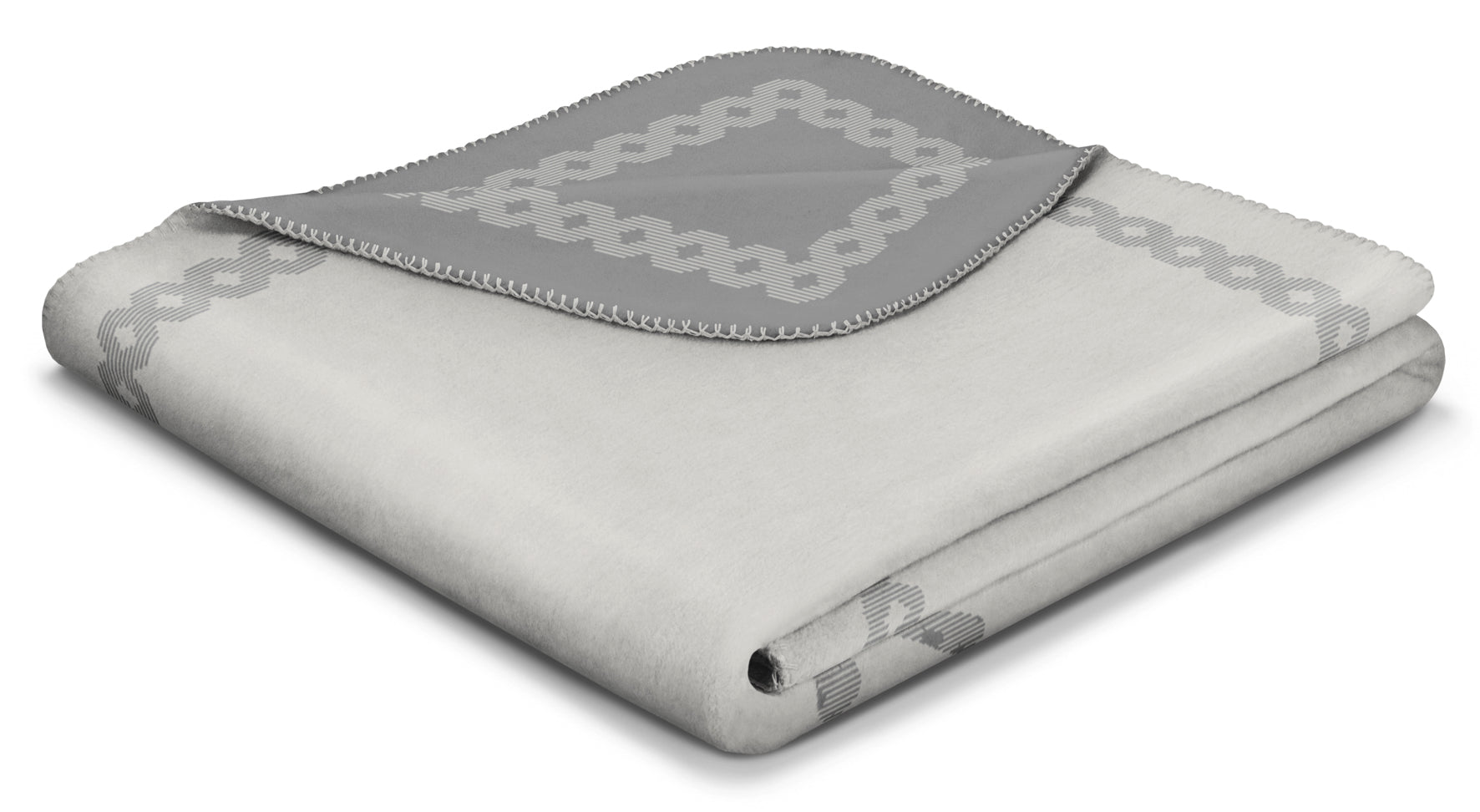 Folded Stag's Head Blanket in shades of grey with geometric patterned boarder.