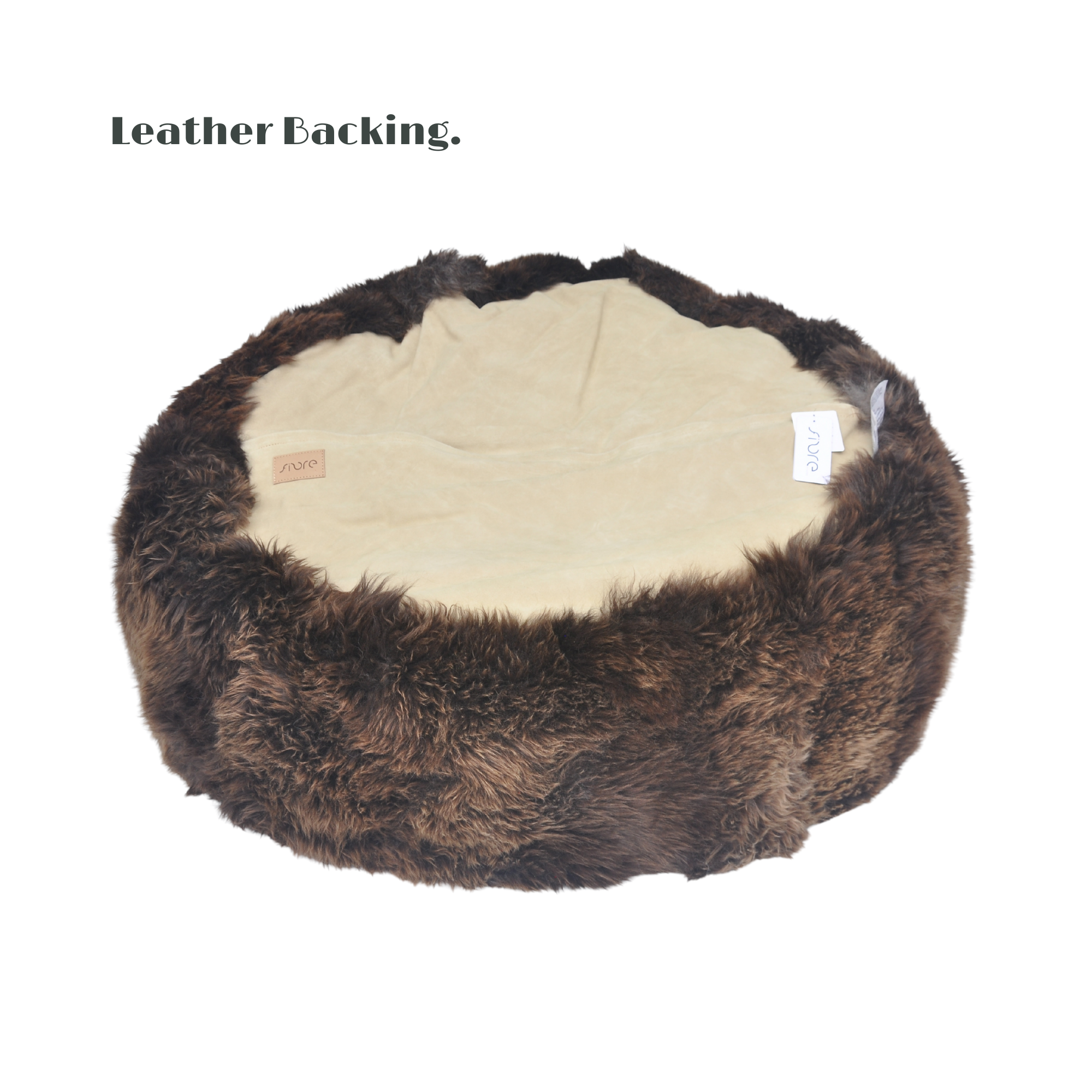 Underside of a Long Wool Sheepskin Bean Bag • Natural Brown wool. Base is covered with beige suede and a zip closure.