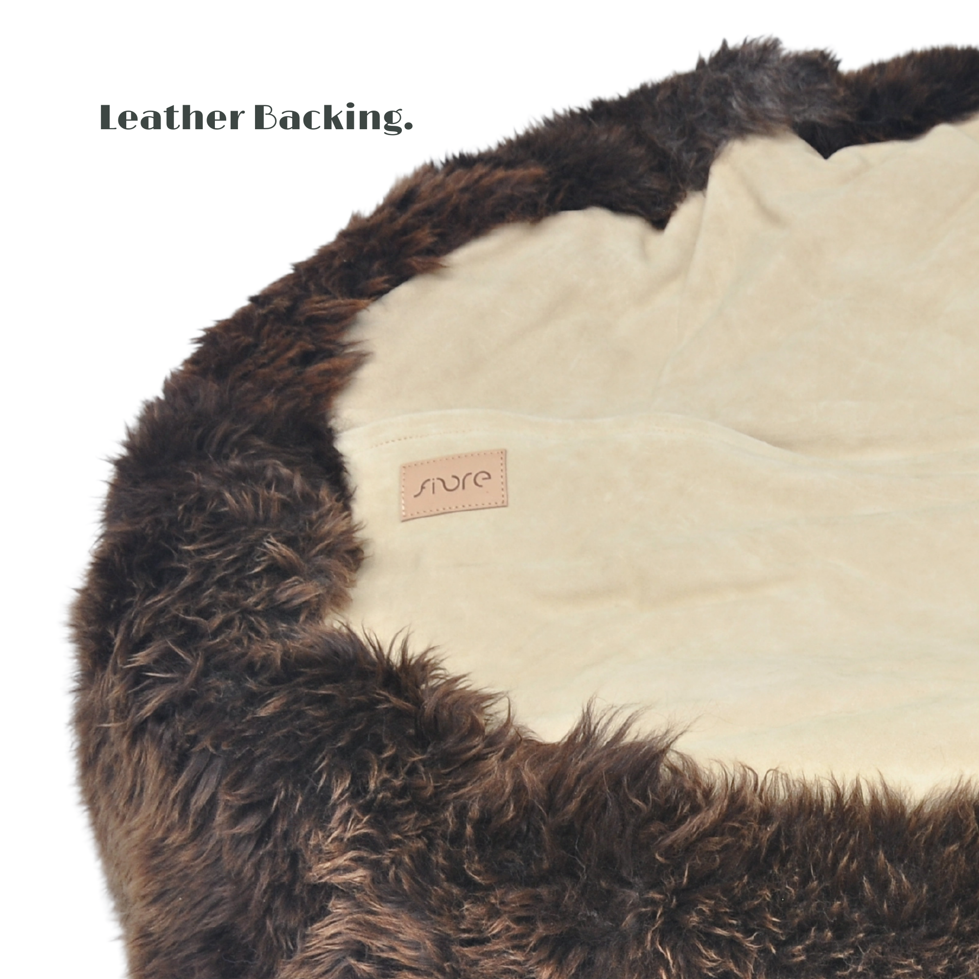 Bottom of a Long Wool Sheepskin Bean Bag • Natural Brown wool. Base is covered with beige suede and a zip closure.