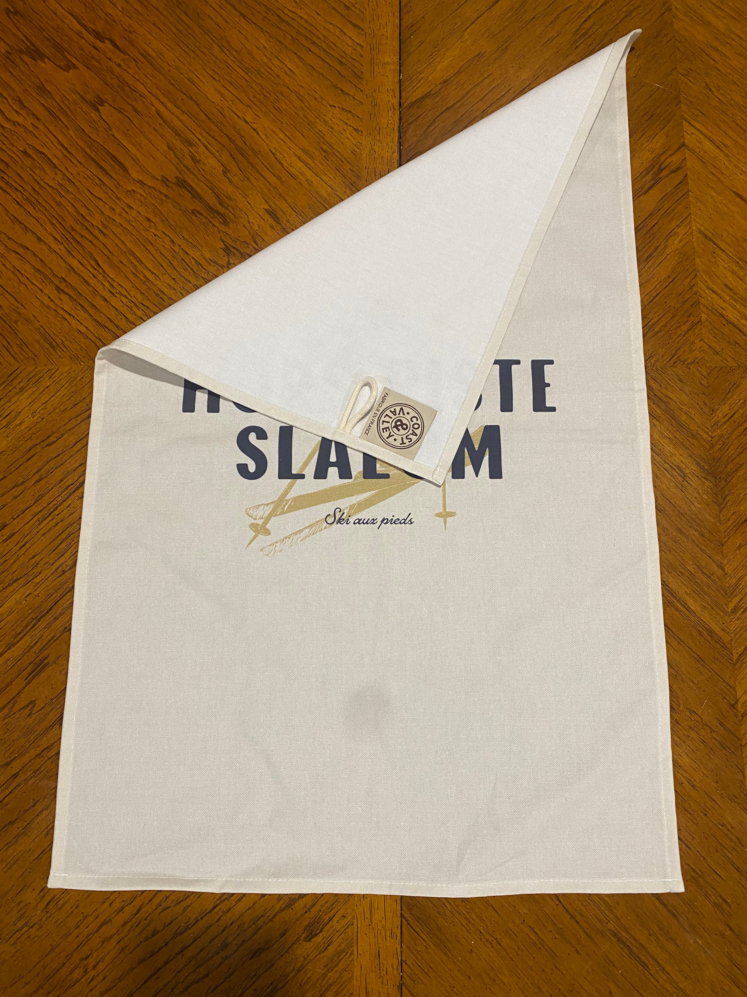 Hors Piste vs Slalom Tea Towel, with label showing