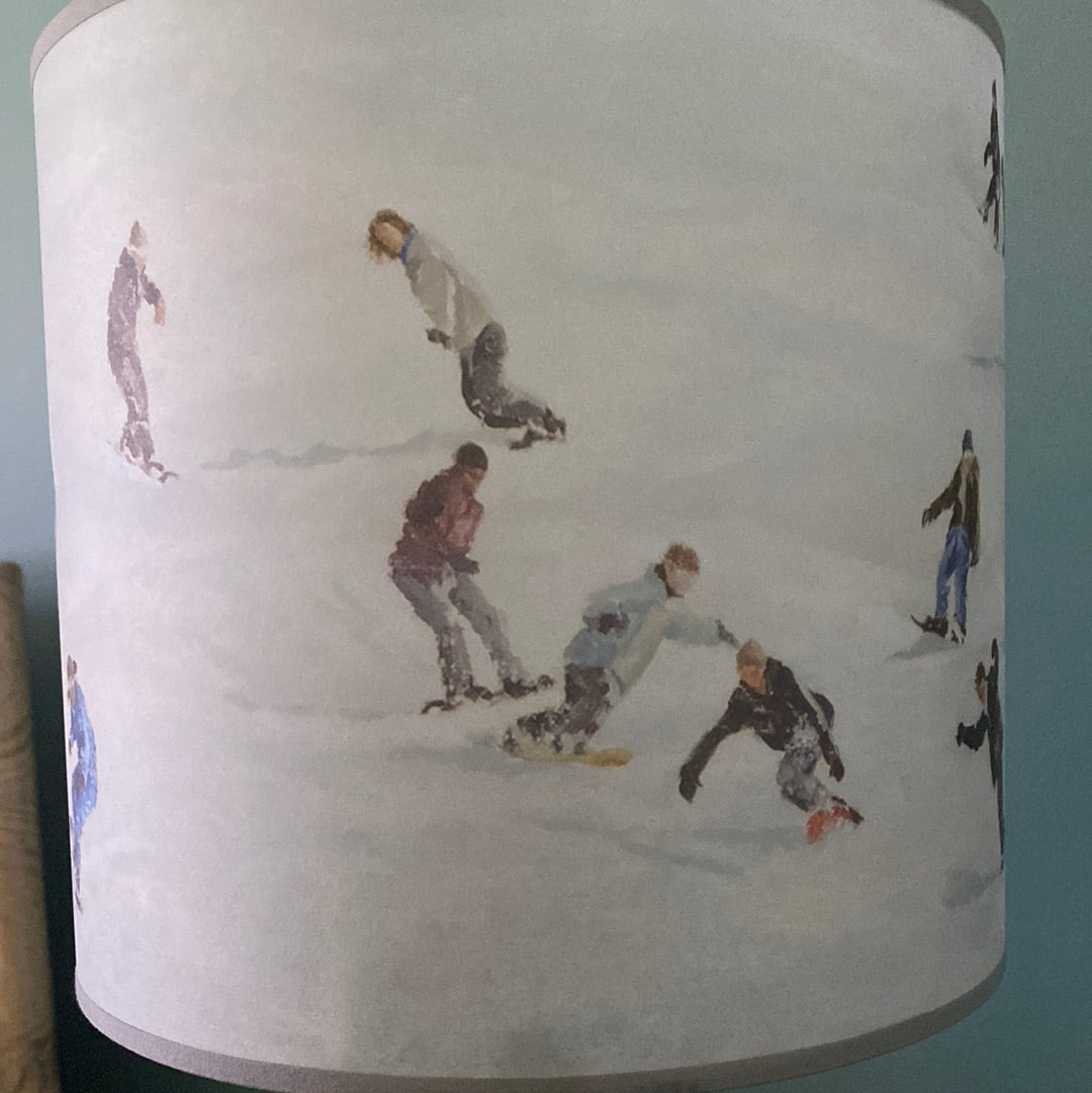 Close up of Snowboard lamp shade, in front of a green wall version 2